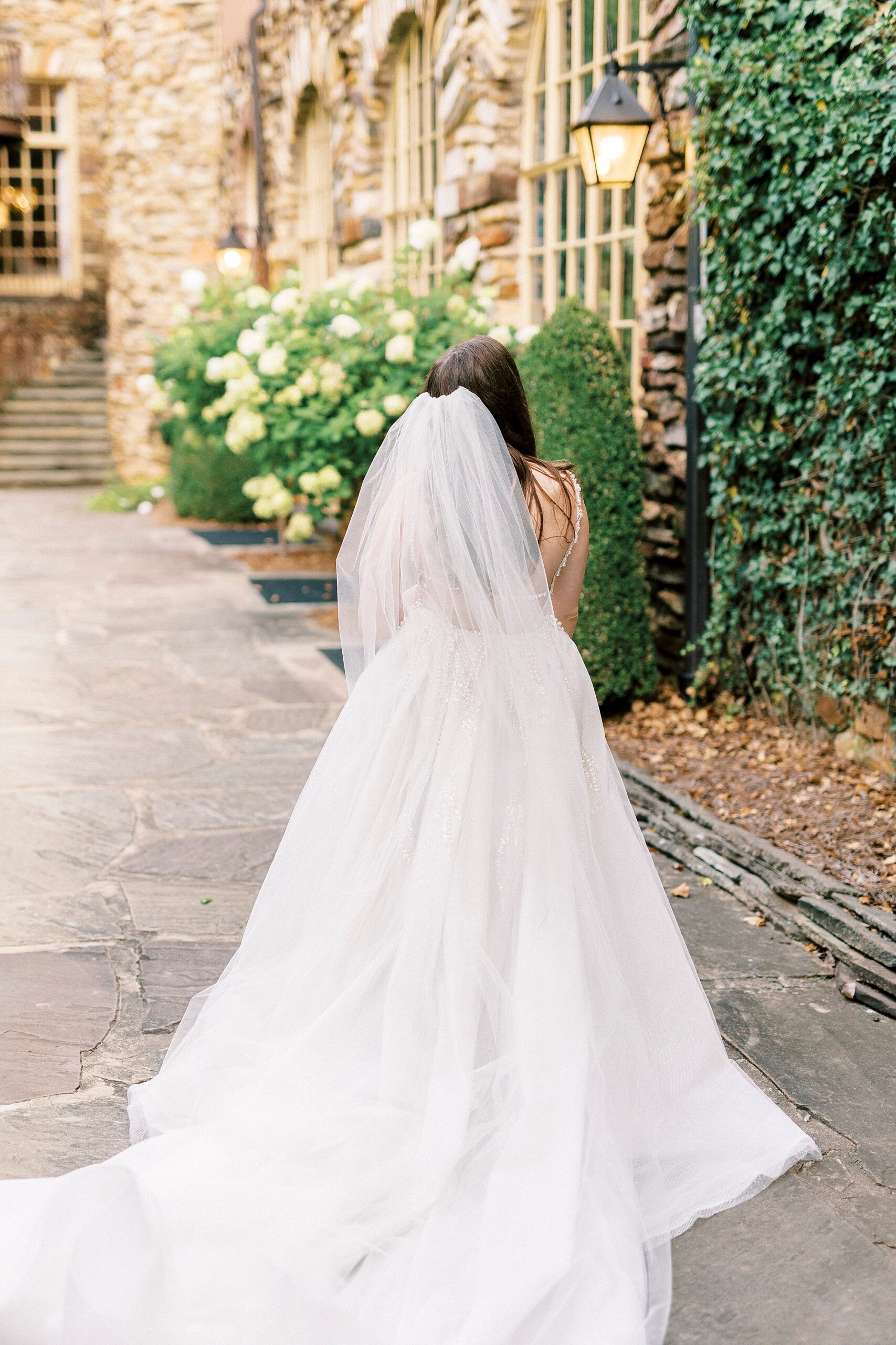 bride looks up at the Graylyn Estate
