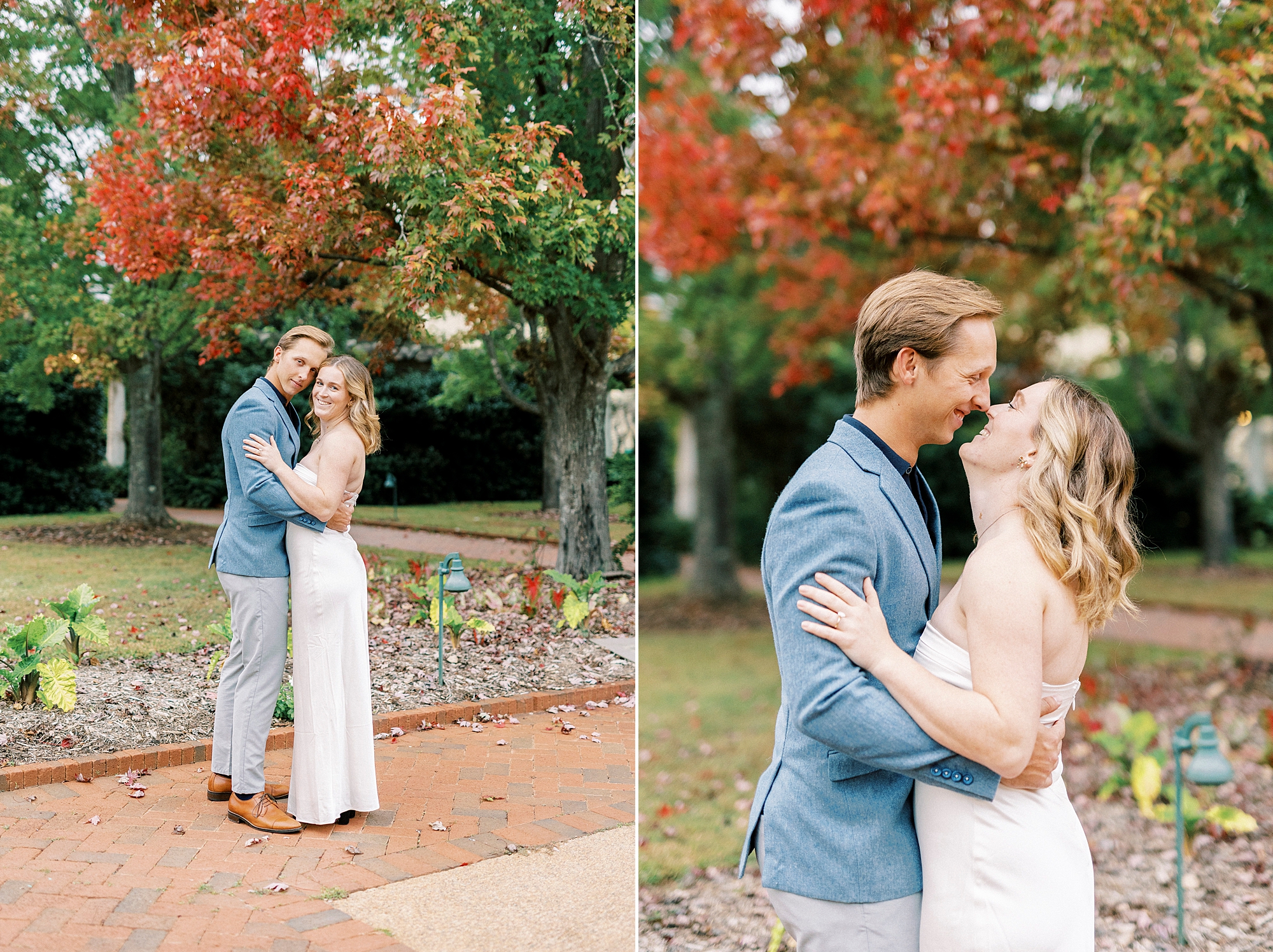 engaged couple hugs laughing under red and orange trees