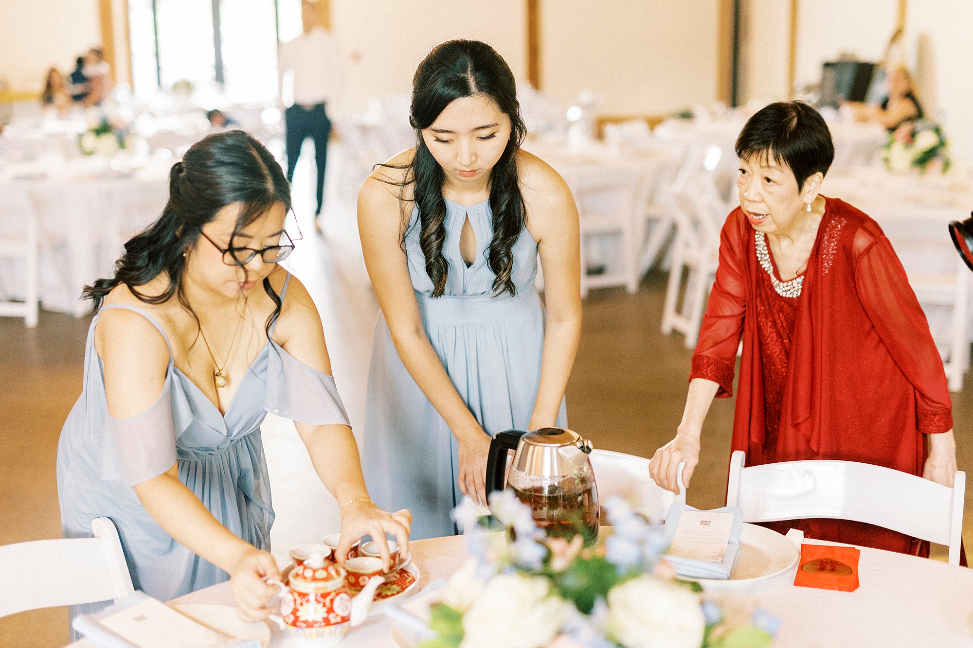 bridesmaids help prepare tea ceremony 