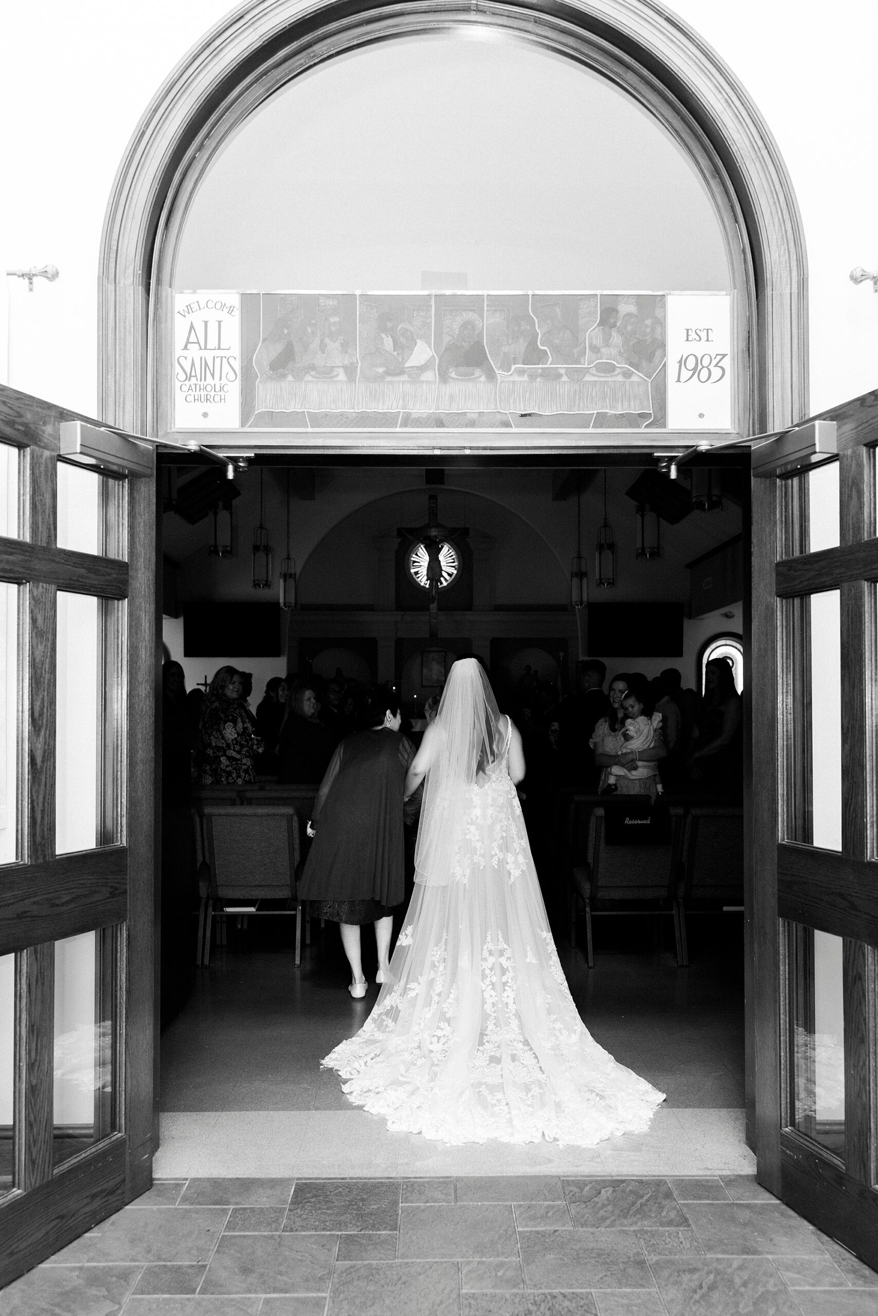 bride stands in doorway of Belmont NC chapel 