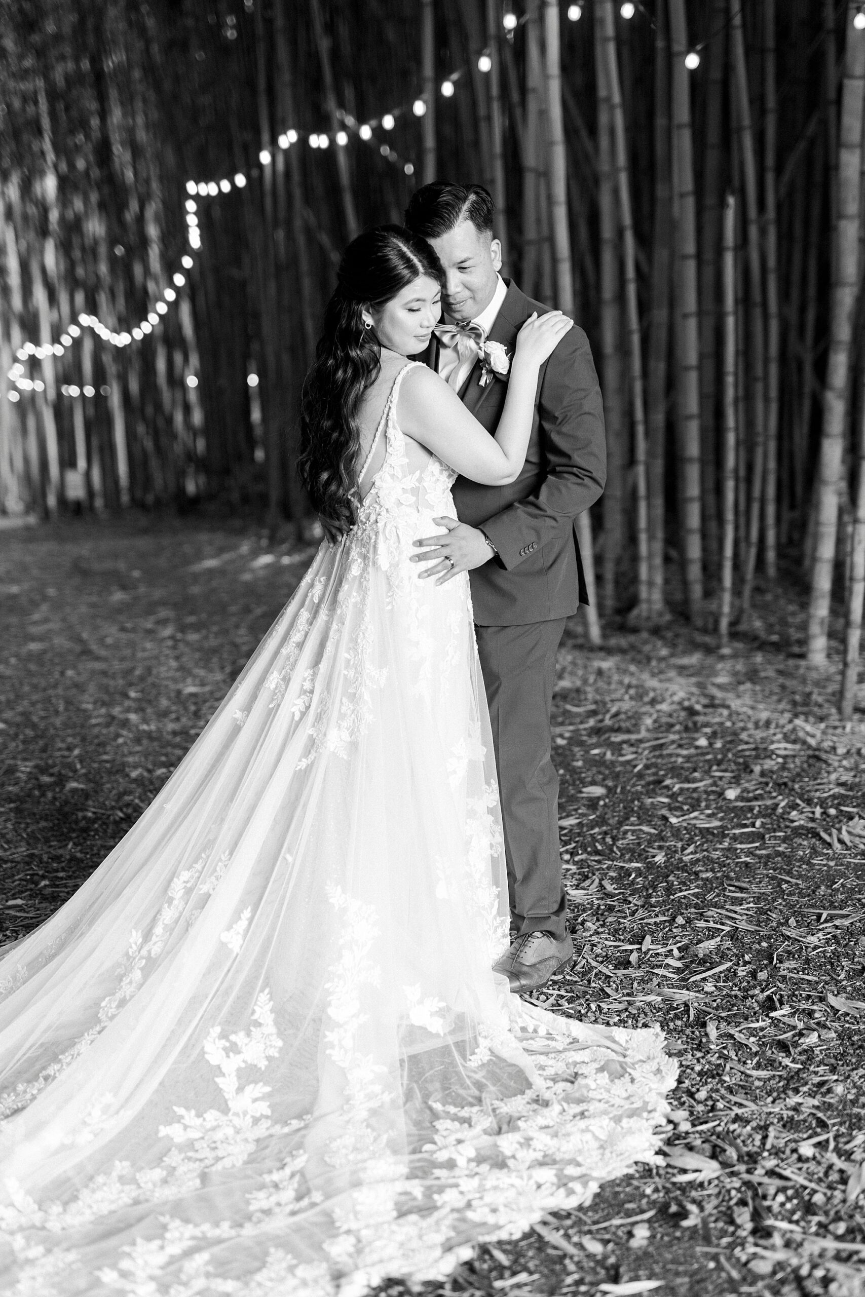 bride and groom hug inside bamboo forest at Camelot Meadows
