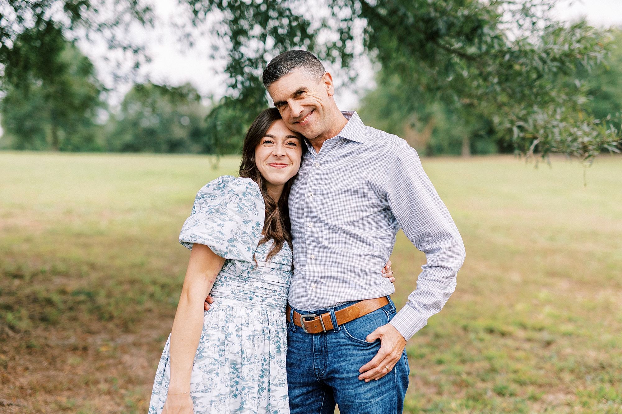 dad and daughter hug during family photos in Rob Wallace Park