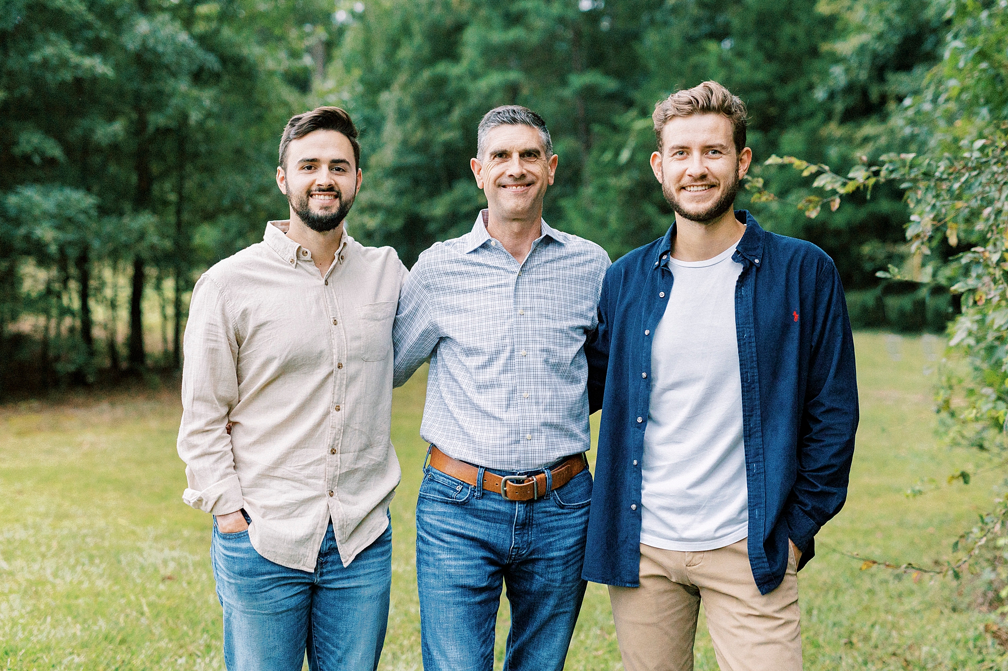 dad hugs two sons in law at Rob Wallace Park