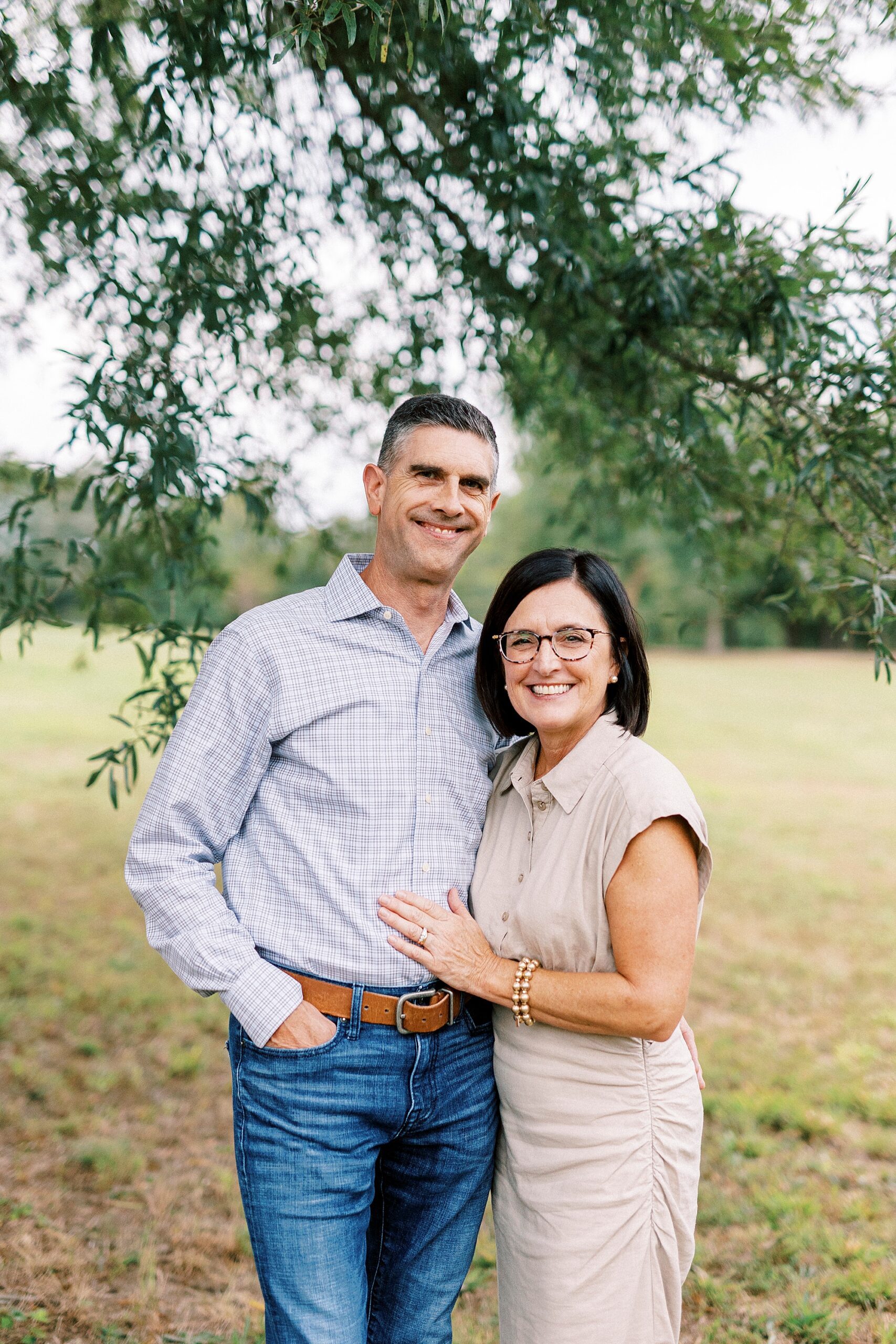 couple hugs together during NC family photos