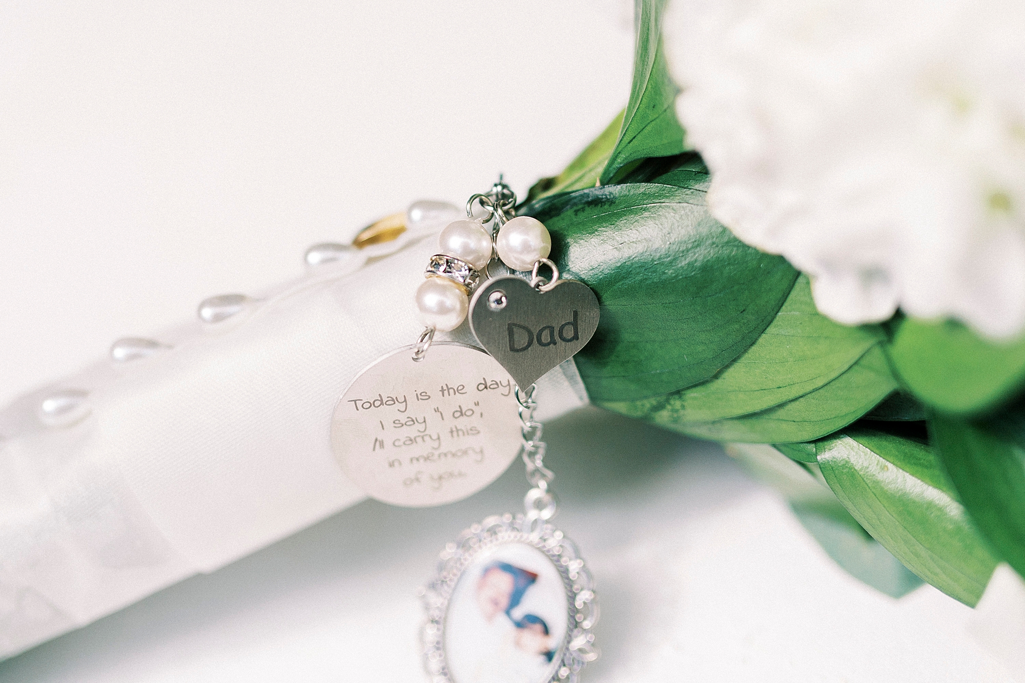 bride's bouquet with silver charms on the stems