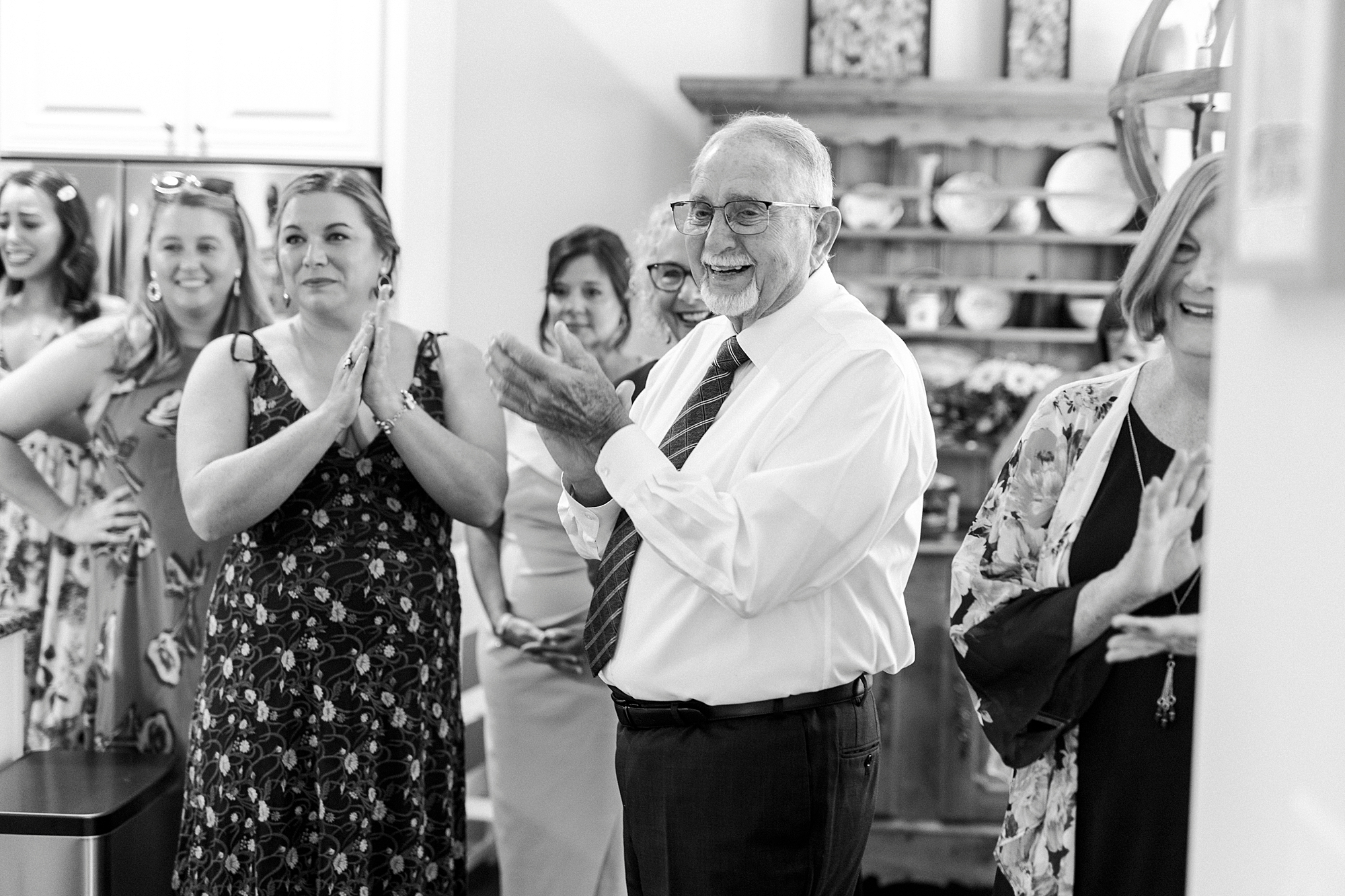 family claps after seeing bride for the first time