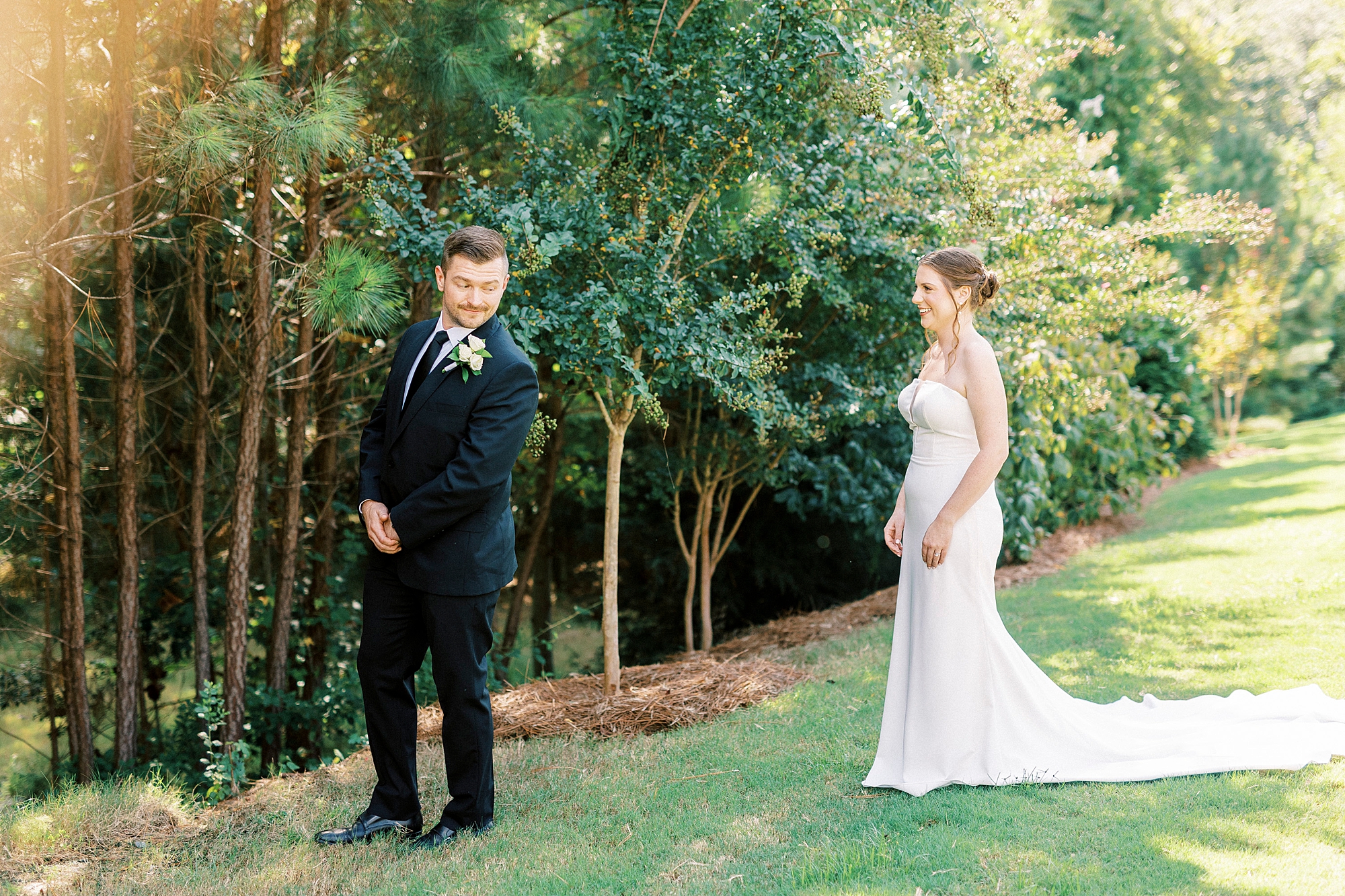 bride approaches groom for first look 