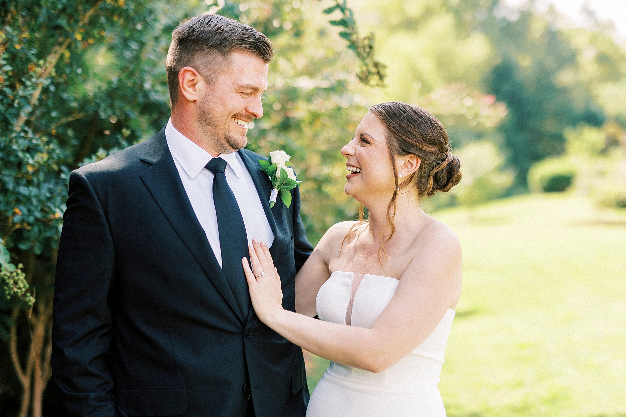 bride laughs looking up at groom during wedding at the Palisades