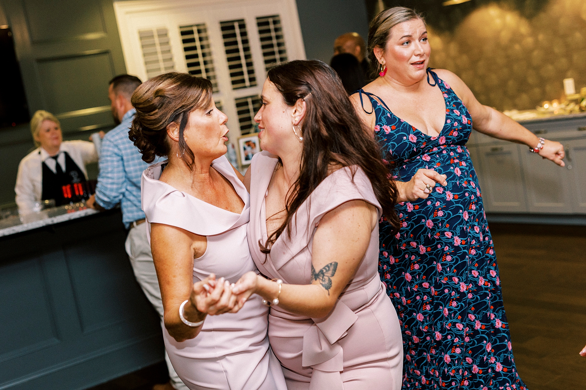 wedding guests dance during wedding reception at Palisades Country Club