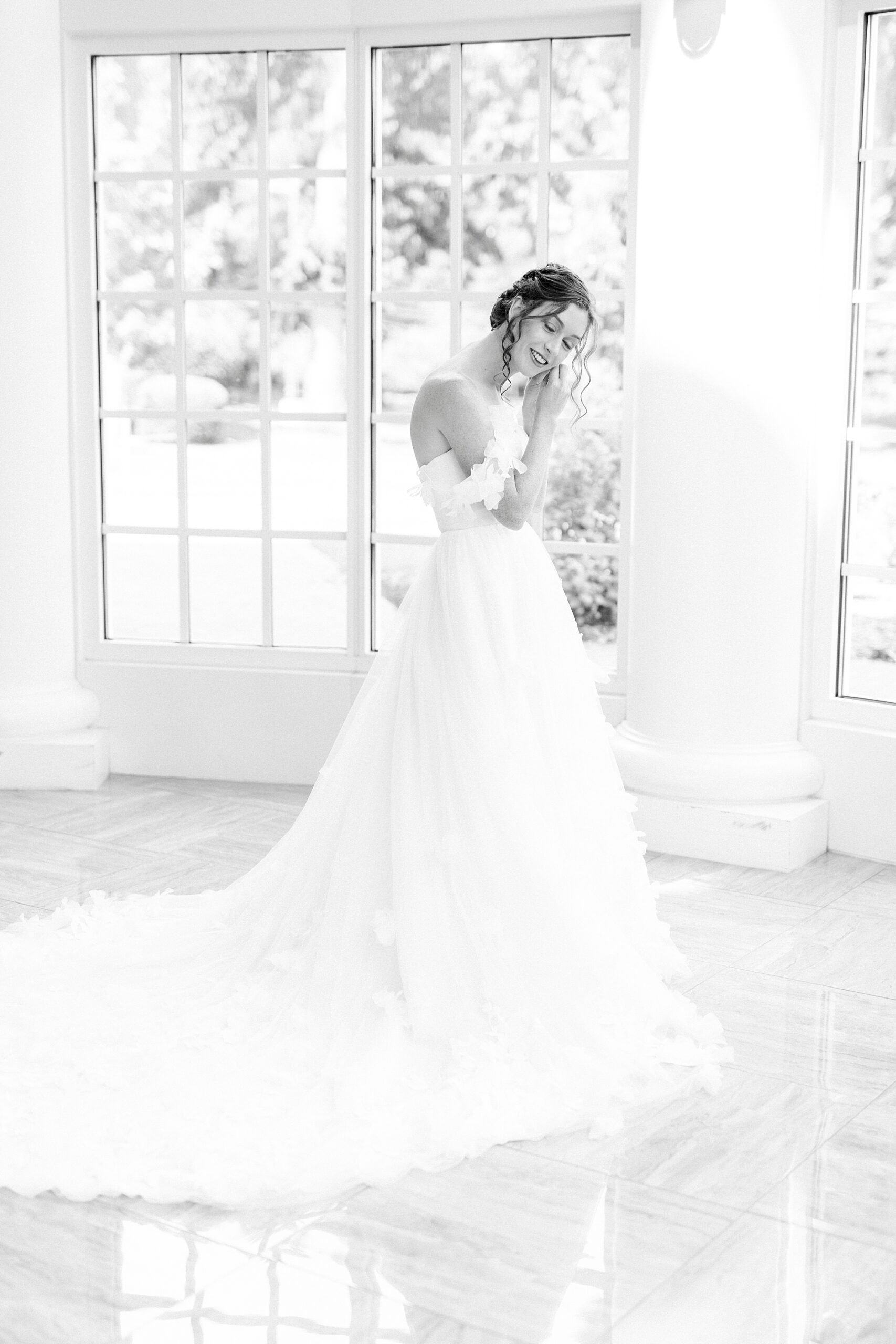 bride prepares for wedding day in the atrium of the Belk Chapel