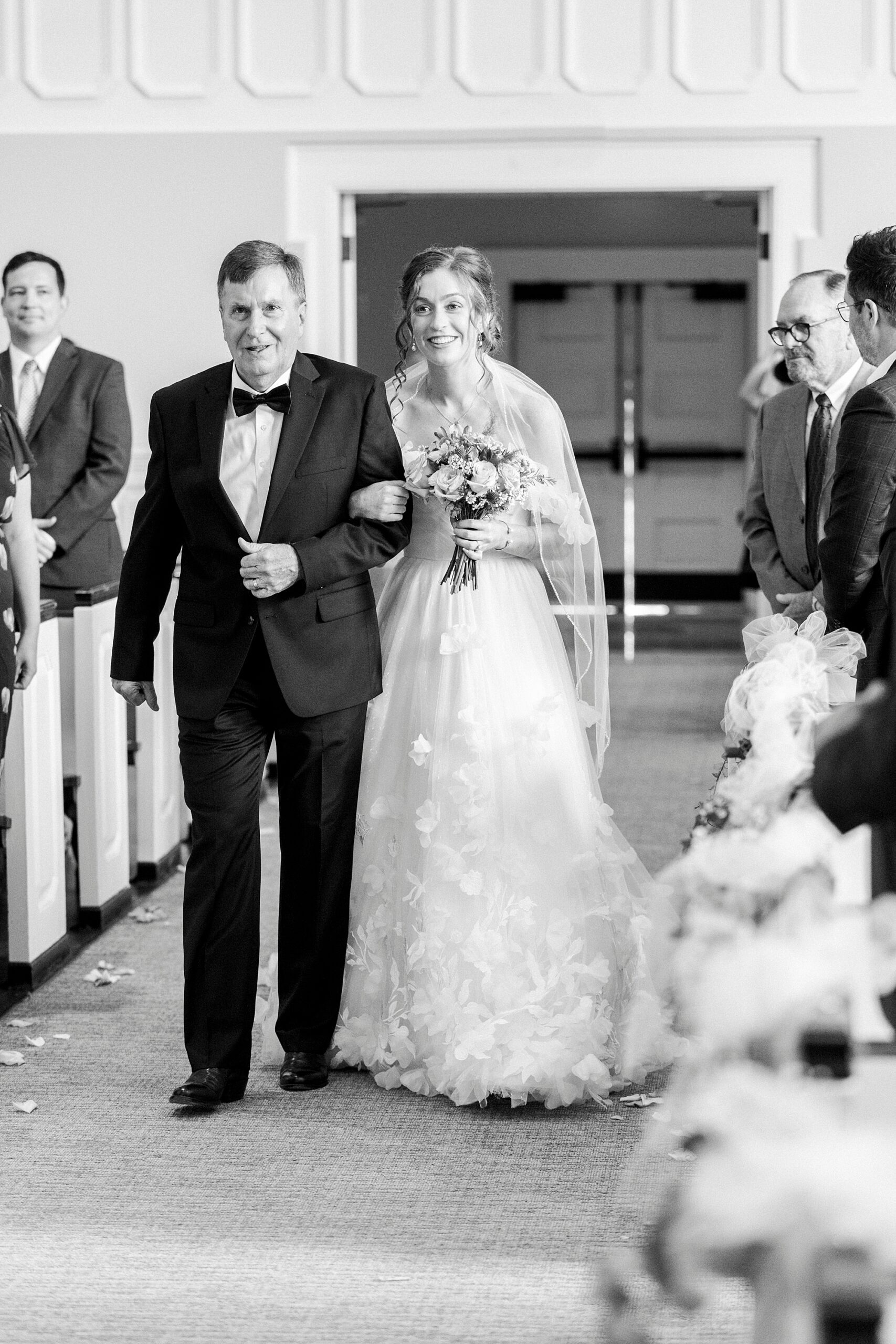 father escorts bride down aisle at Belk Chapel