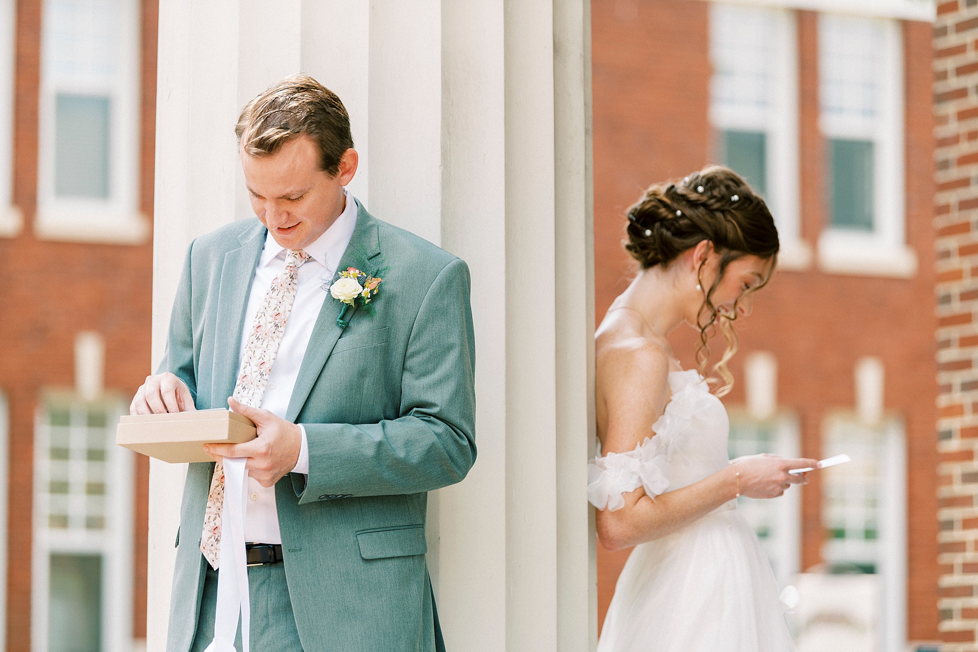 bride and groom read letters during first look