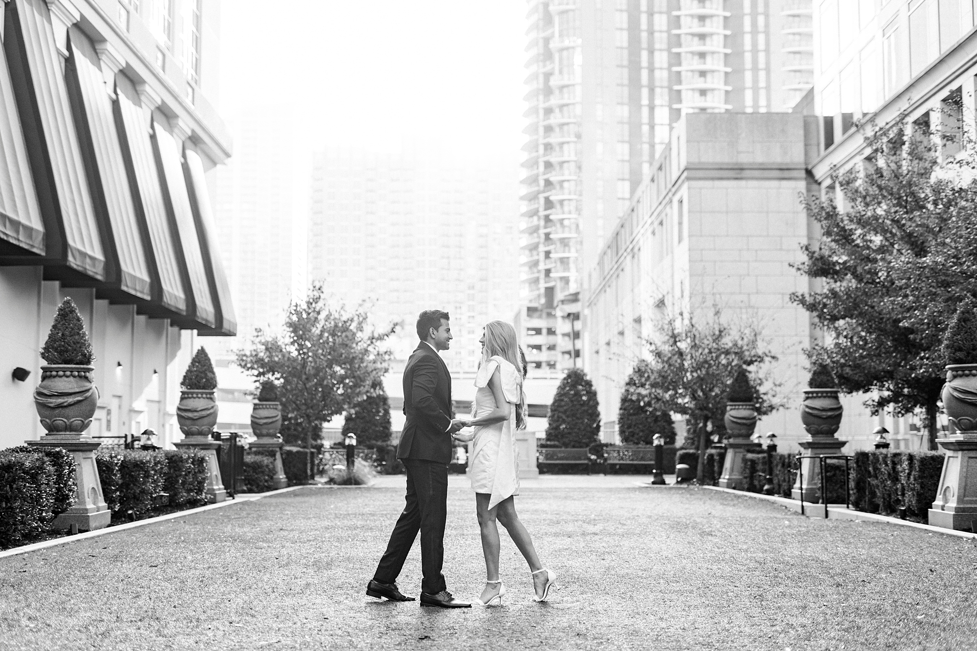 man and woman stand on lawn outside the Grand Bohemian Hotel in Charlotte NC