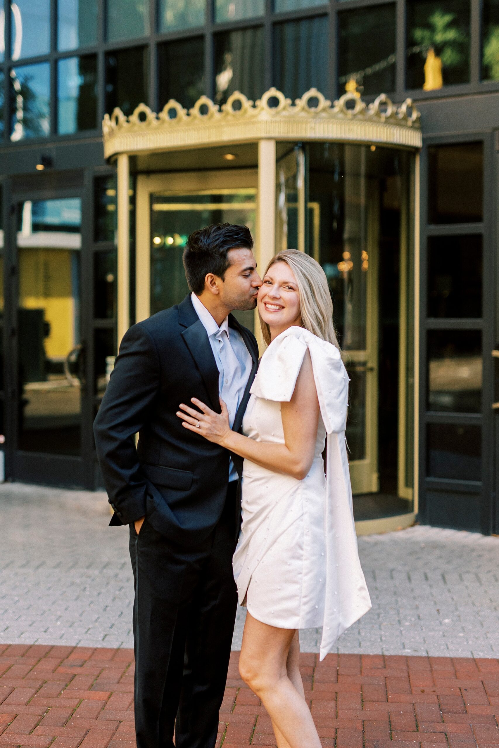 engaged couple hugs outside the Grand Bohemian Hotel in Charlotte NC