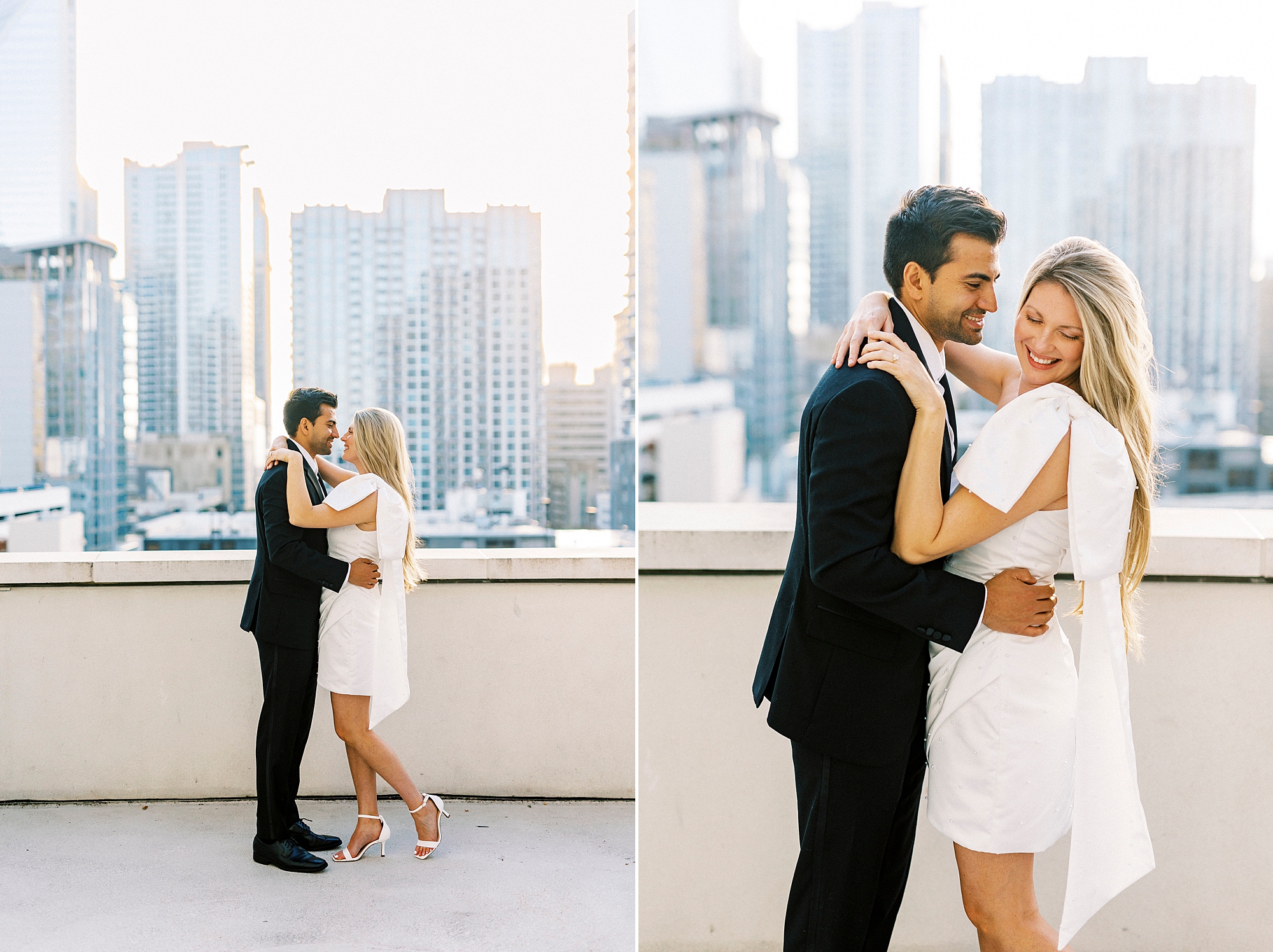 man and woman hug in front of Charlotte NC skyline from the rooftop of the Grand Bohemian Hotel