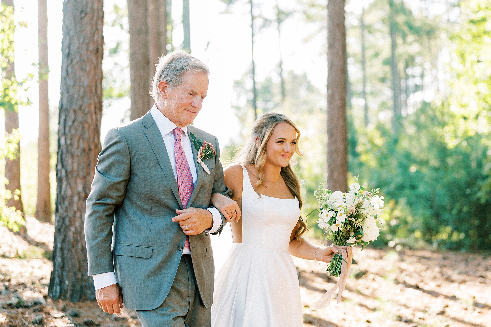 bride walks down aisle with father in backyard of Richfield NC home