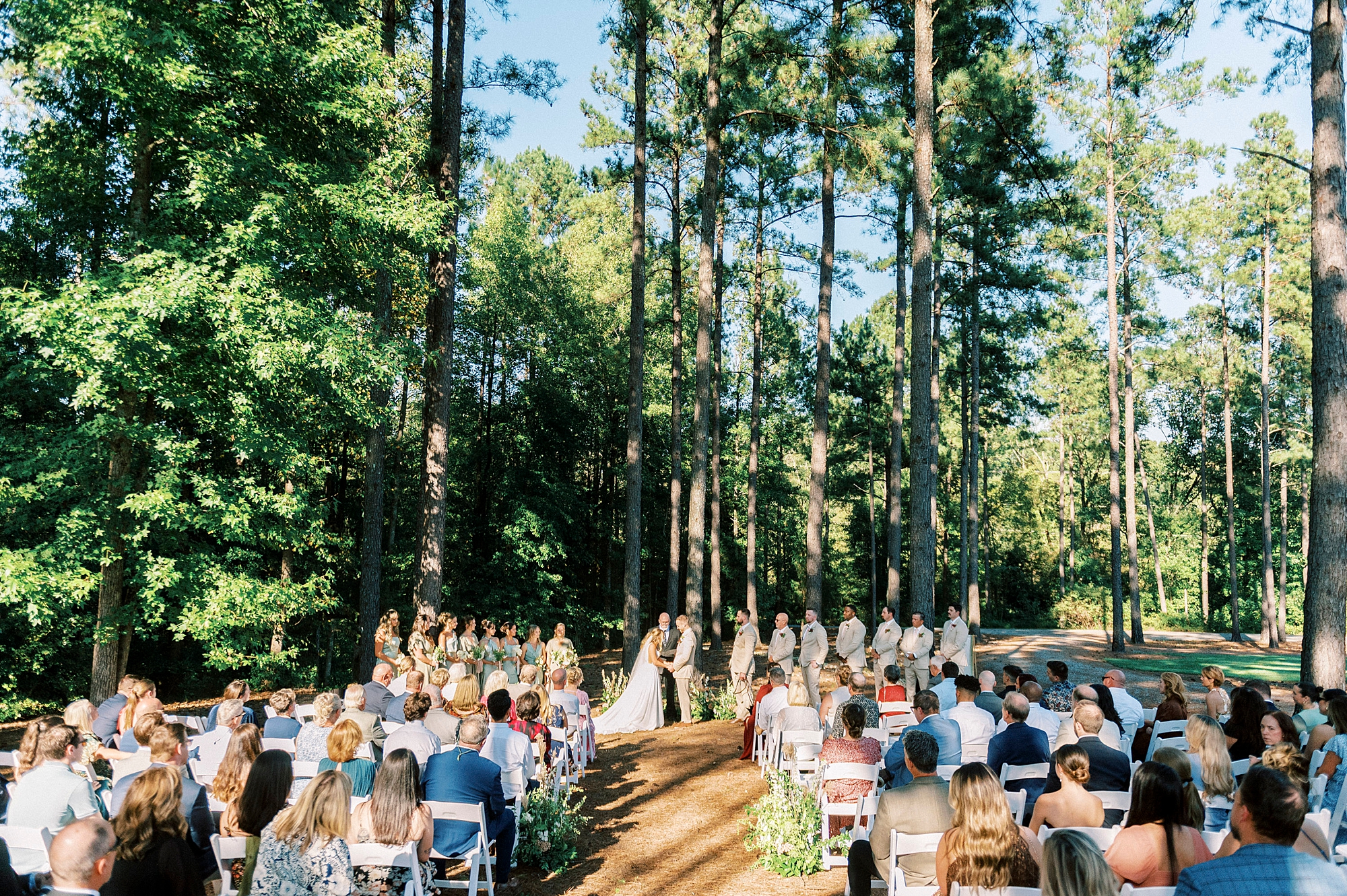 newlyweds stand in backyard of Richfield NC home during ceremony 