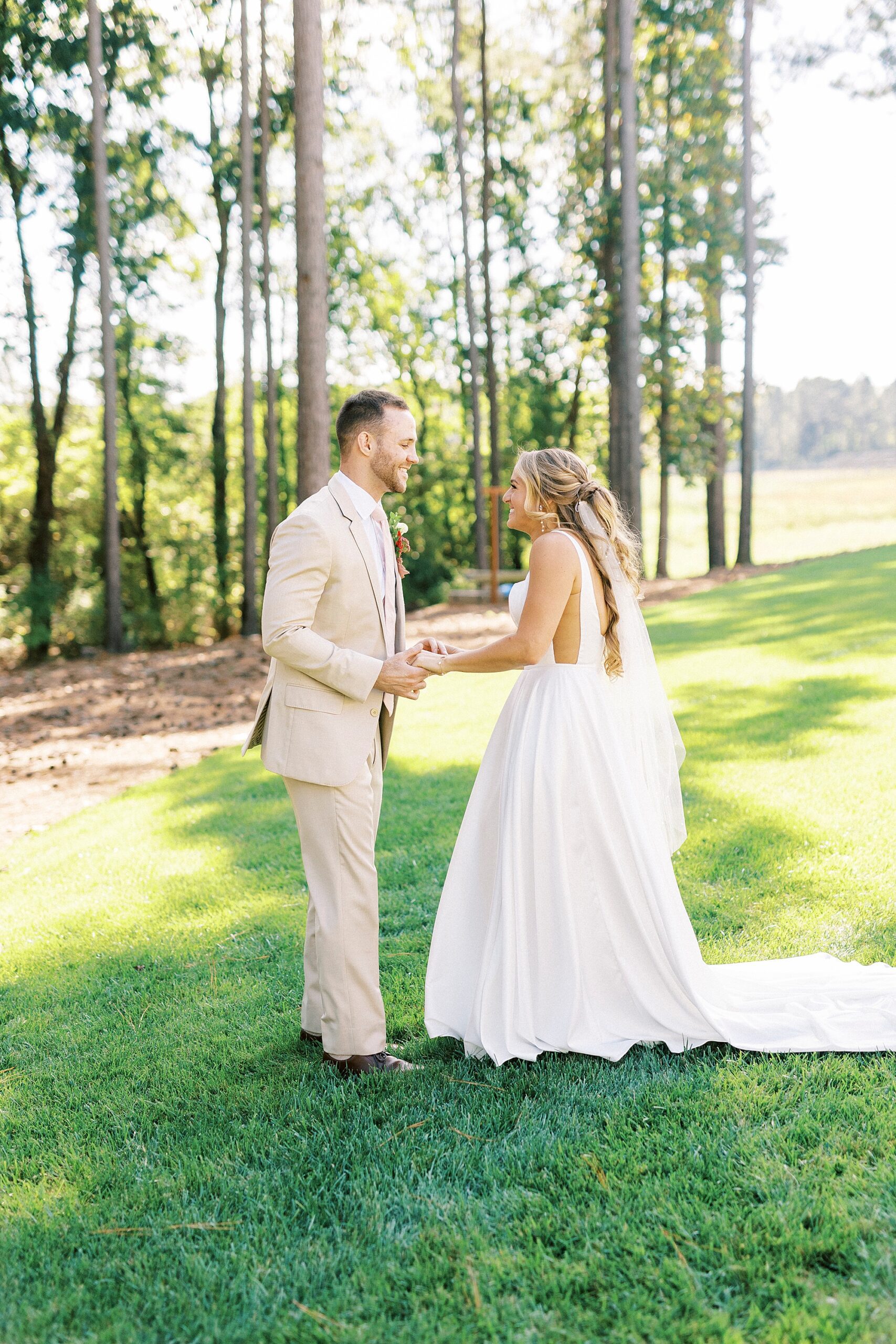 bride and groom hold hands outside home in Richfield NC