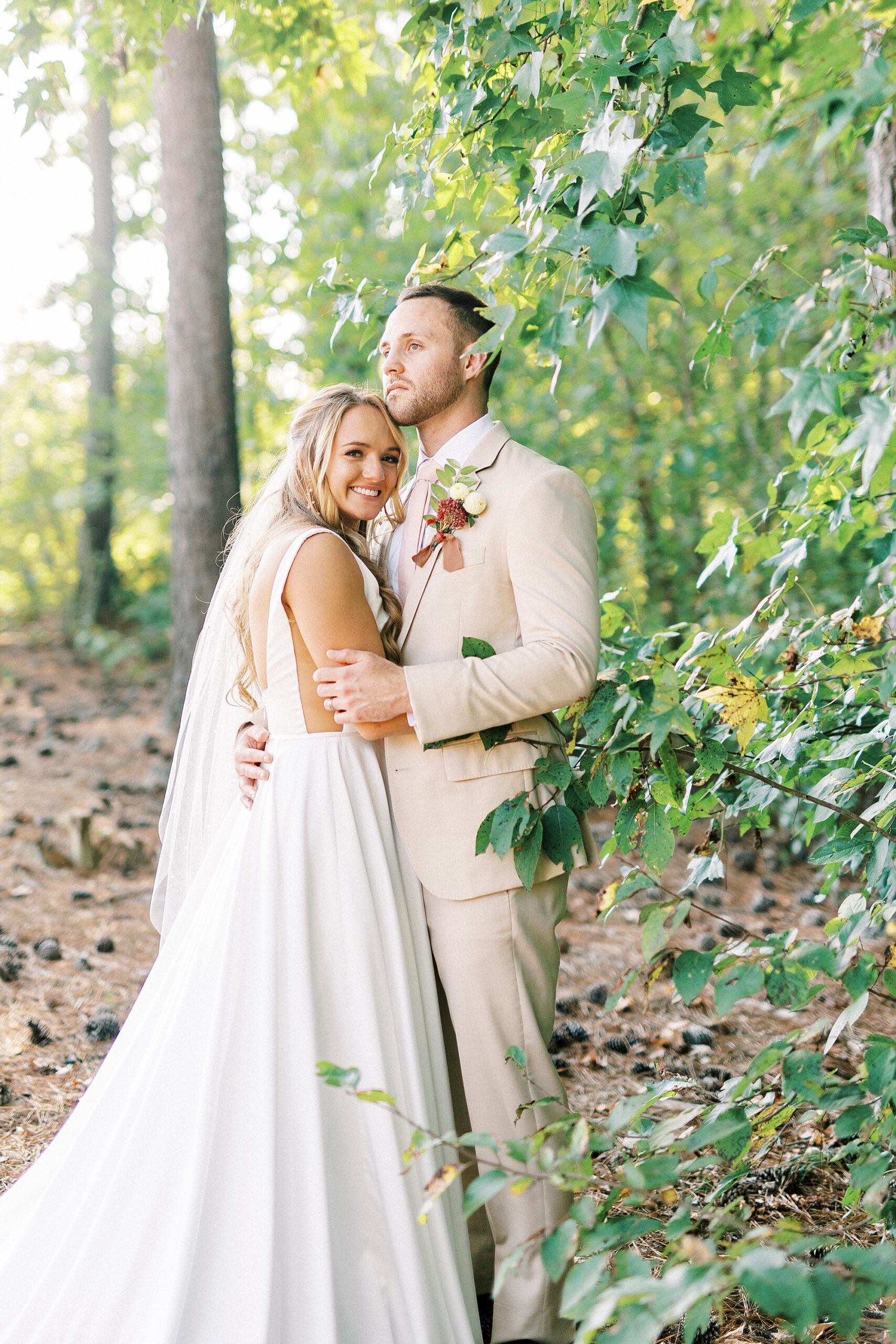newlyweds hug on lawn of Richfield NC home