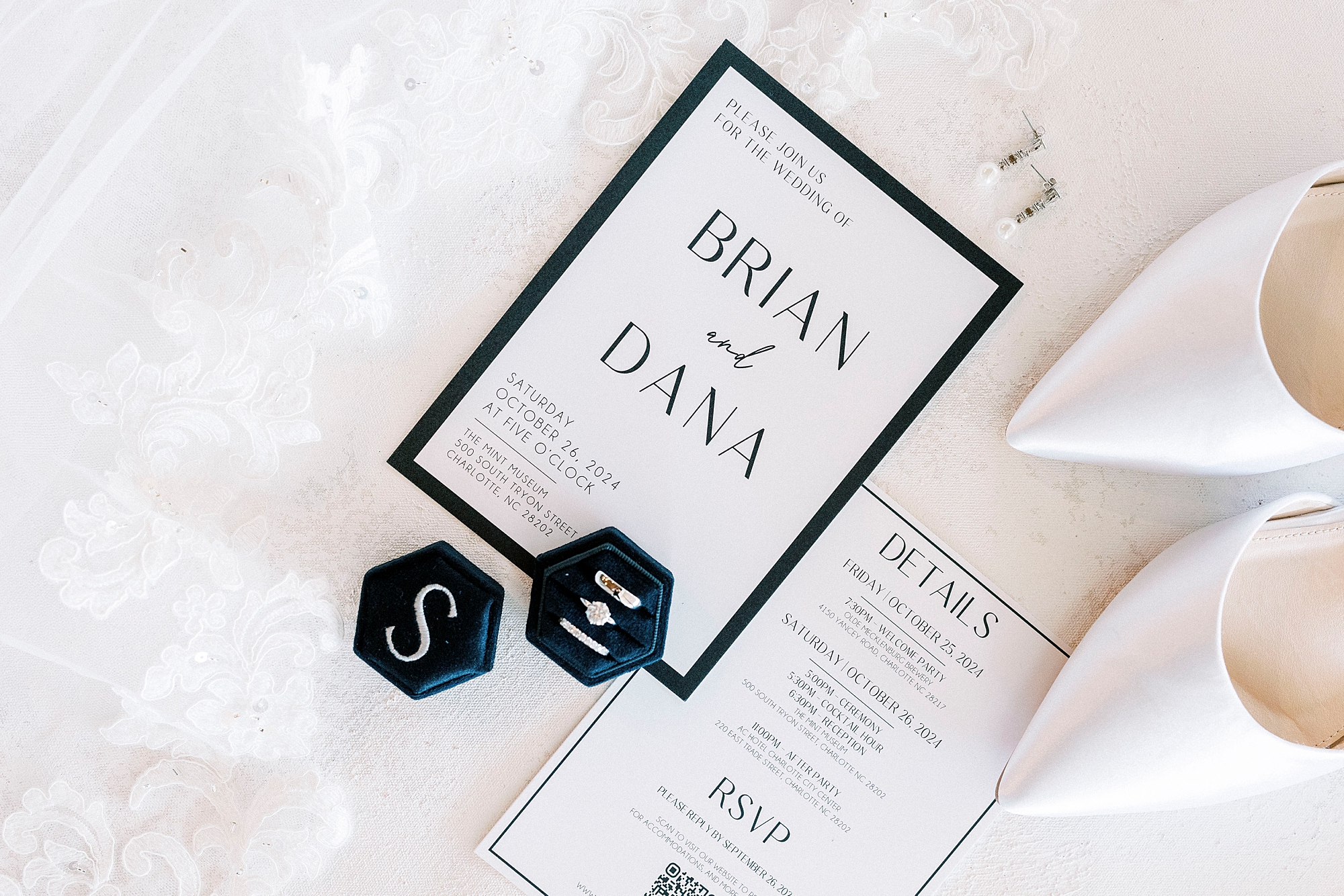 black and white invitation suite with pointy white shoes