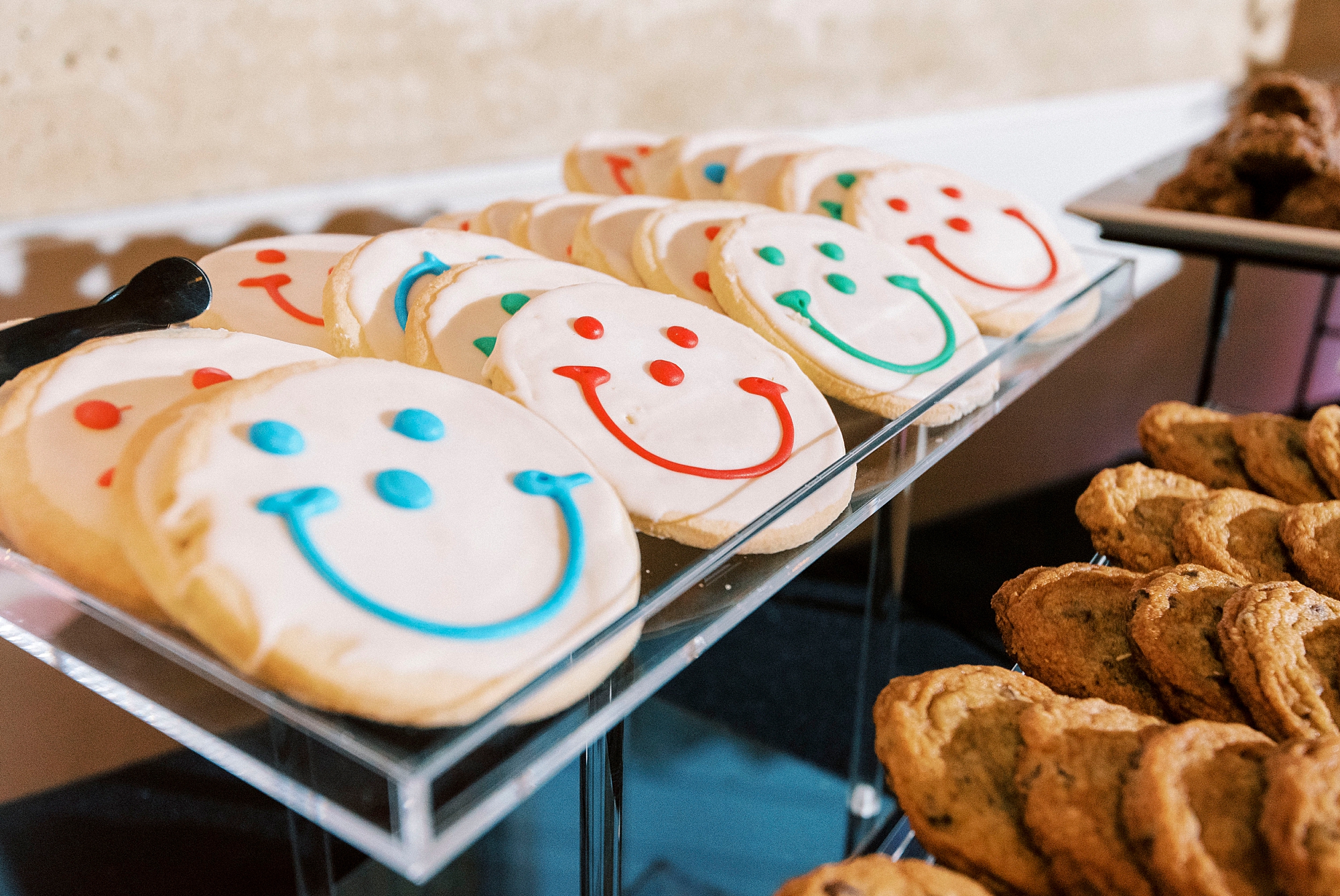 smiley sugar cookies sit on dessert display at the Mint Museum Uptown