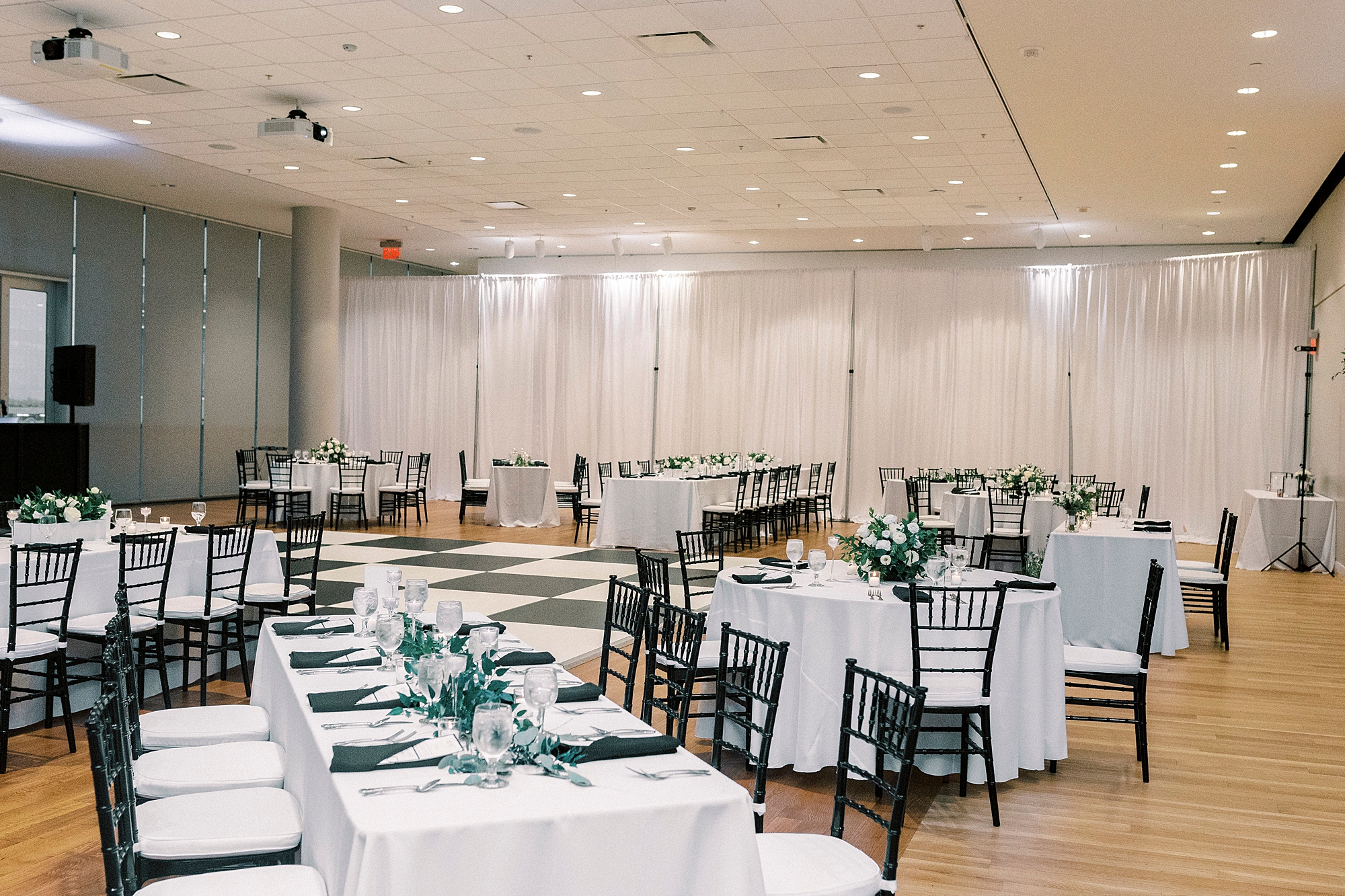 wedding reception with black and white details at the Mint Museum Uptown