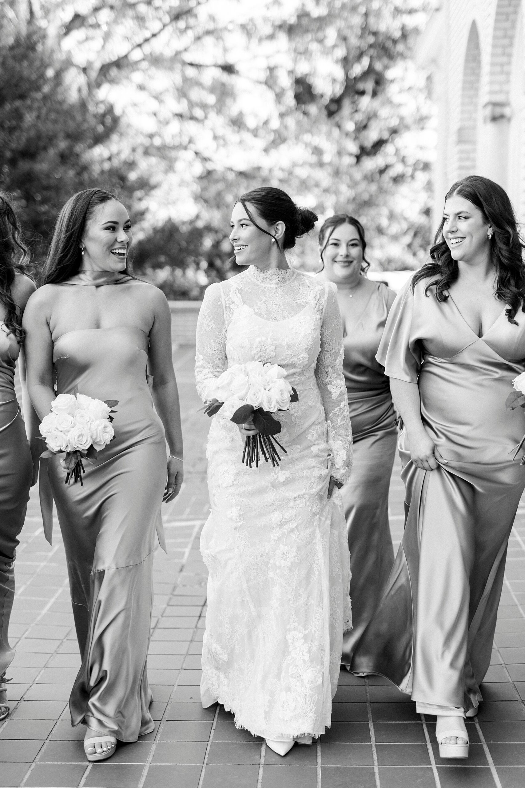 bride walks with bridesmaids in mismatched gowns at Separk Mansion