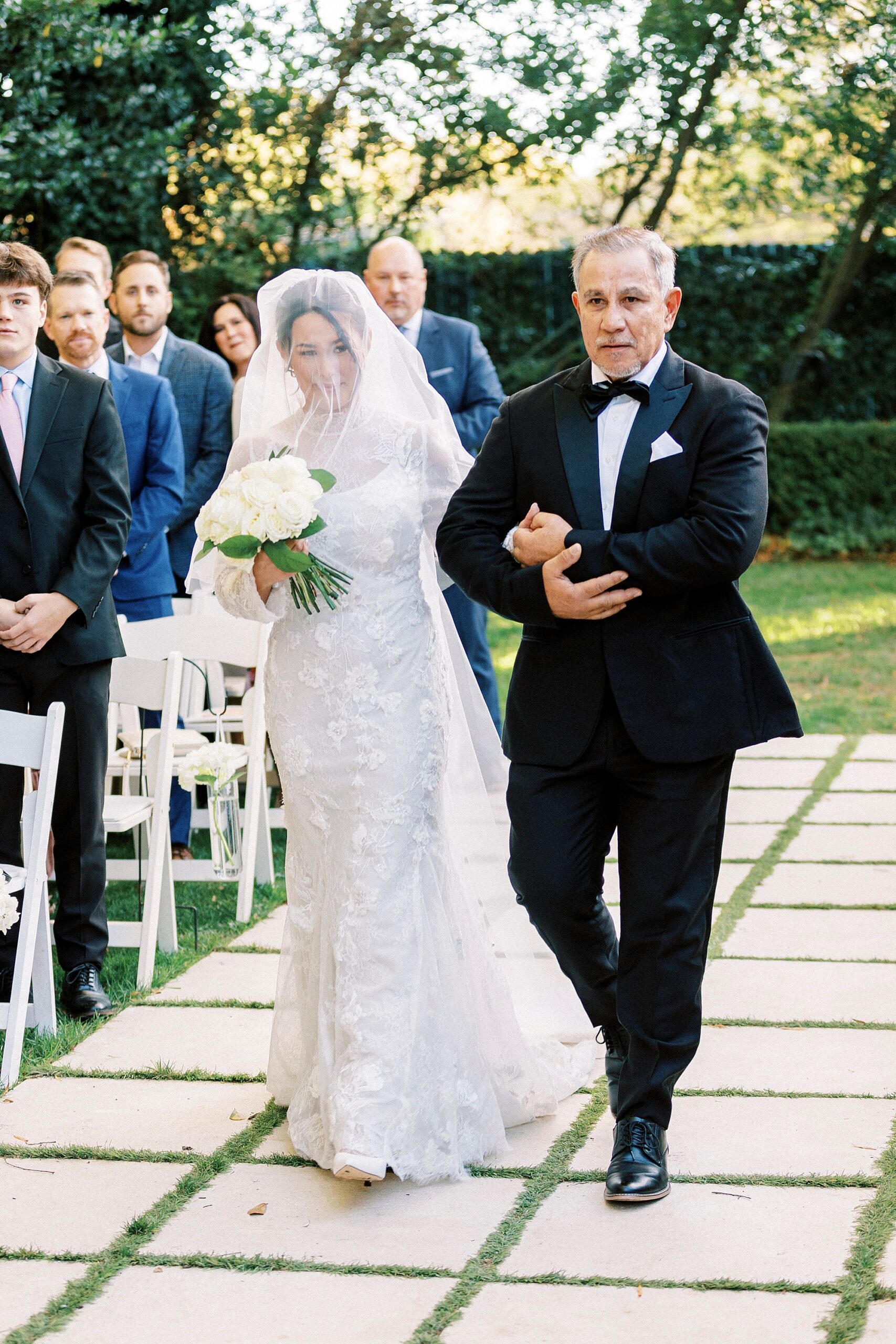 father escorts bride down the aisle for outdoor wedding ceremony at Separk Mansion