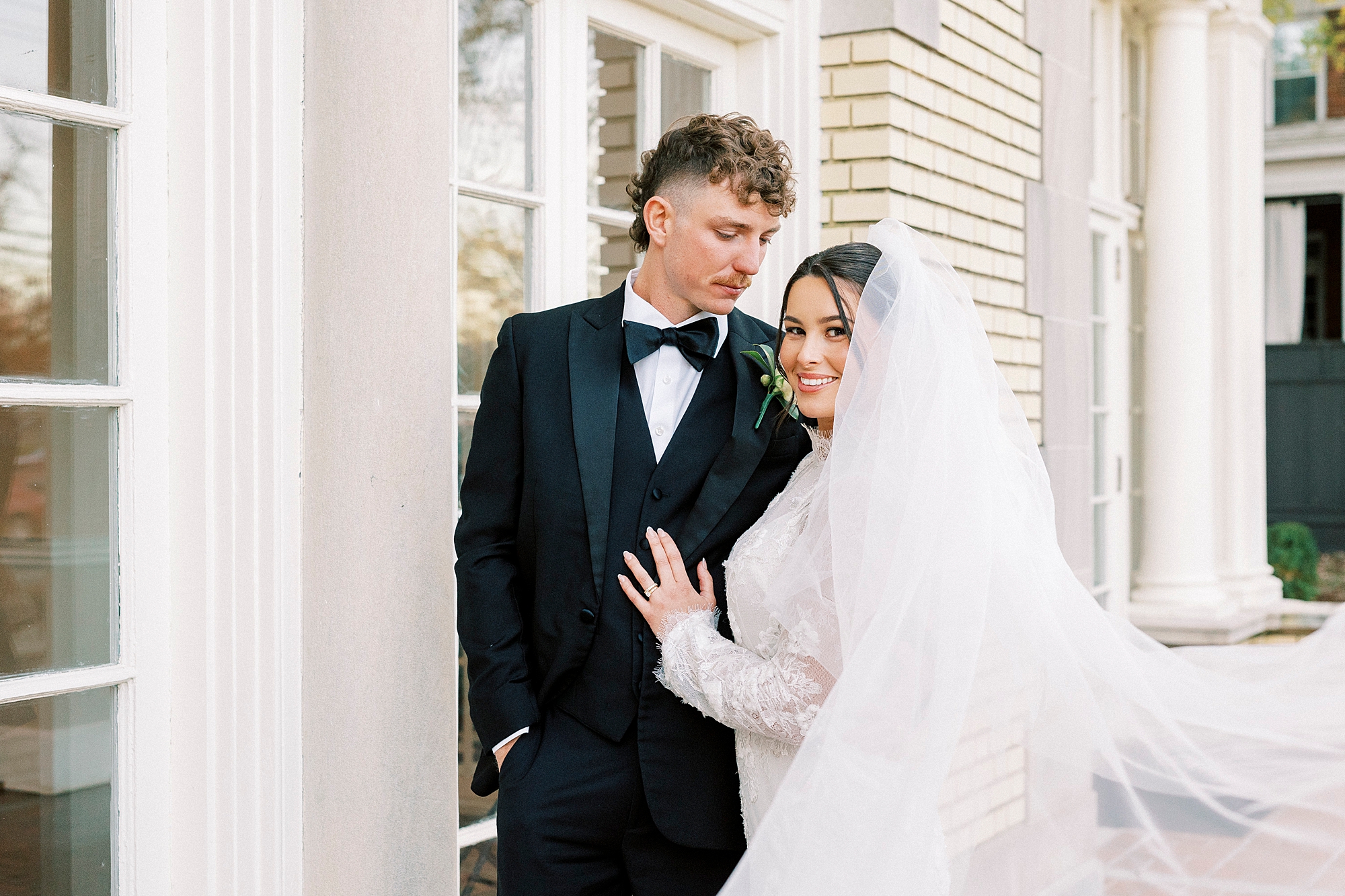 bride and groom stand on patio at Separk Mansion