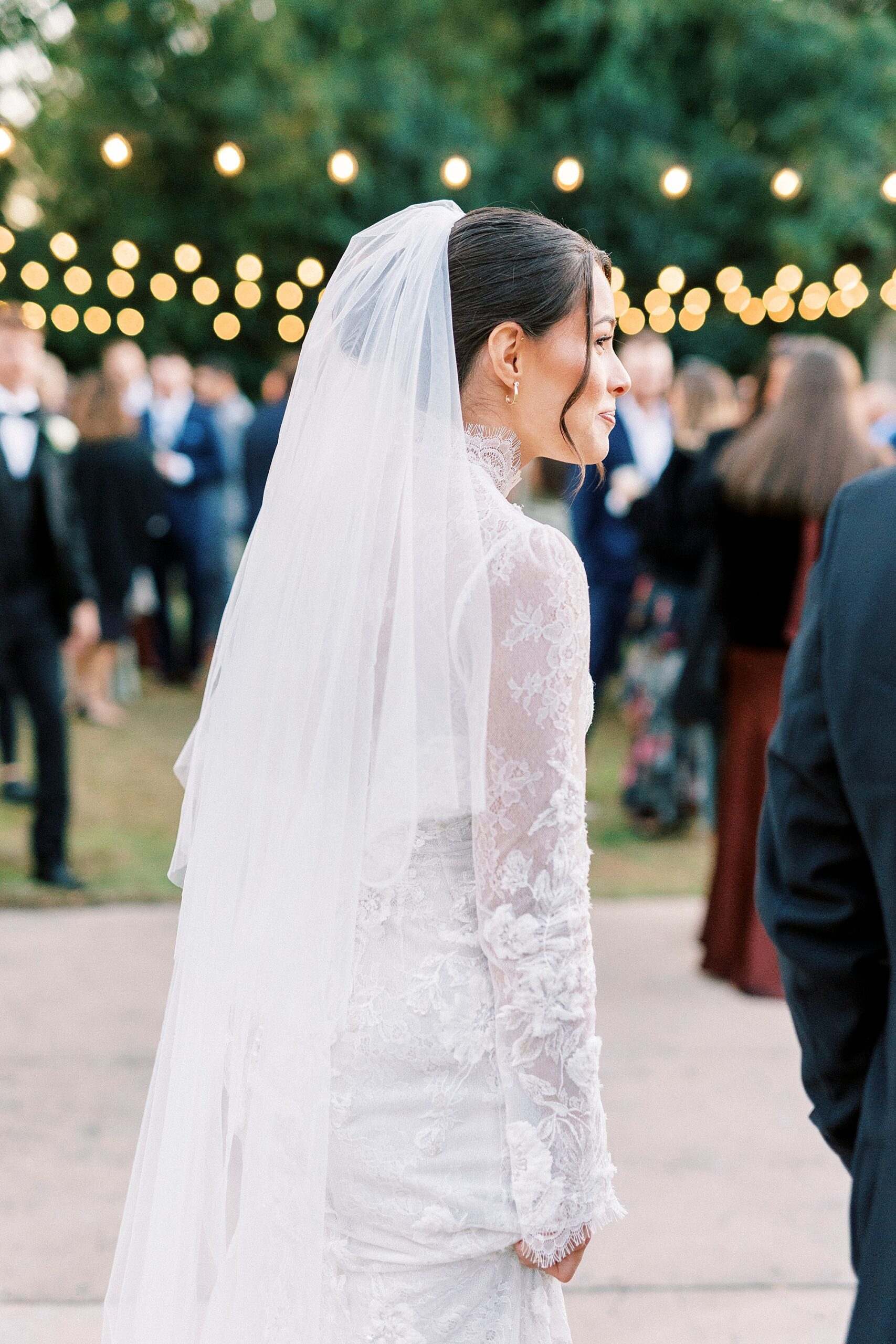 bride walks through cocktail hour on dance floor at Separk Mansion