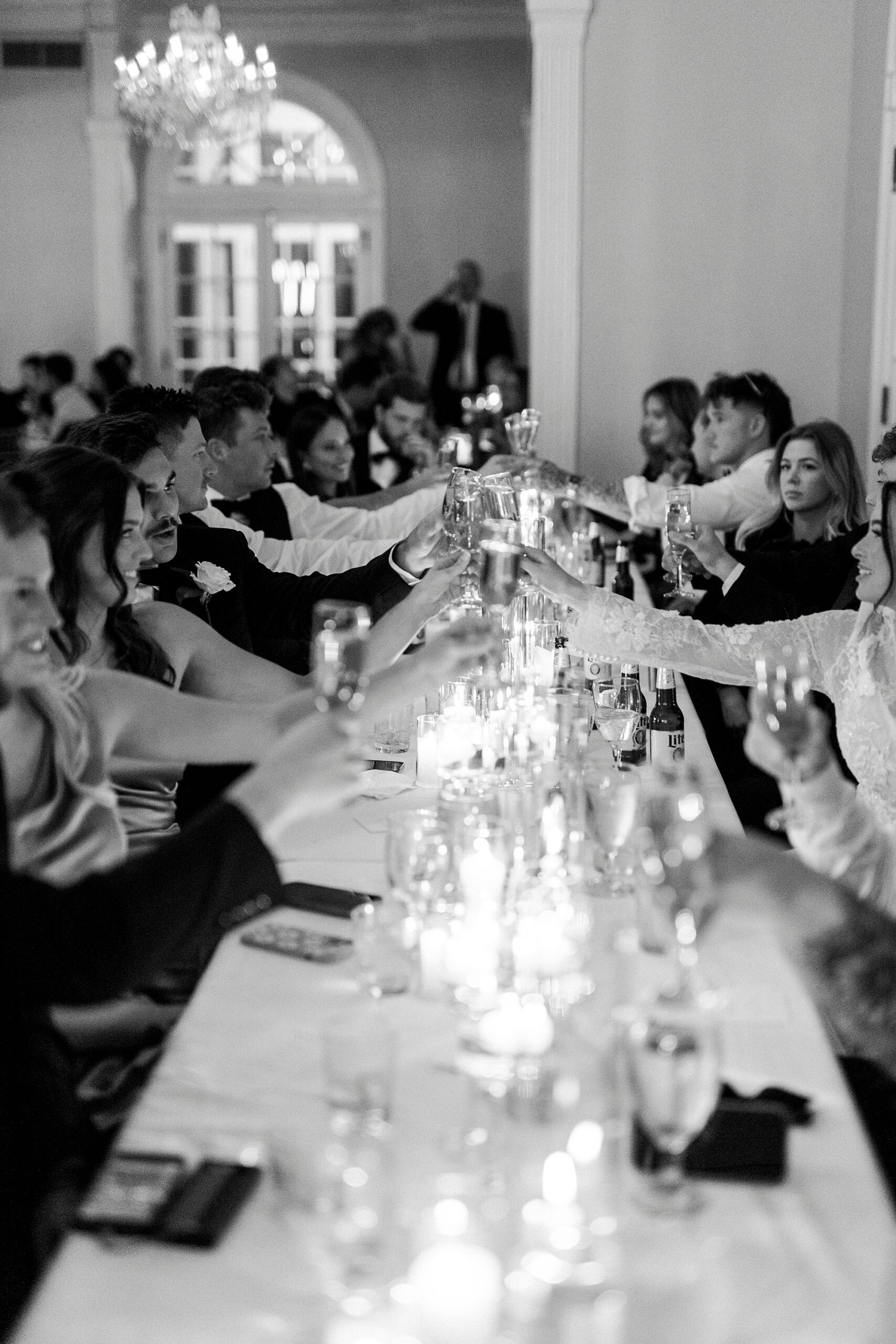 guests toast glasses across long table at Separk Mansion