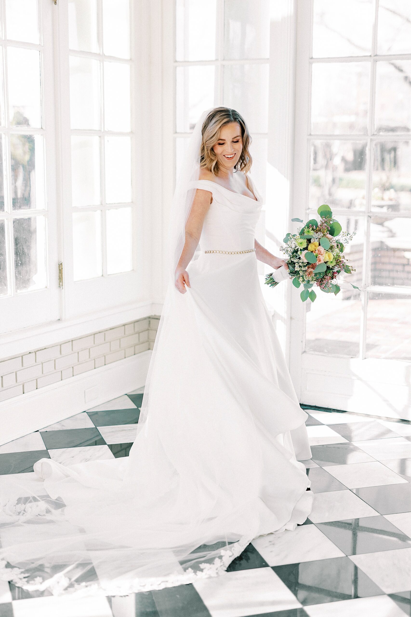 bride twirls in room with black and white floor at Separk Mansion