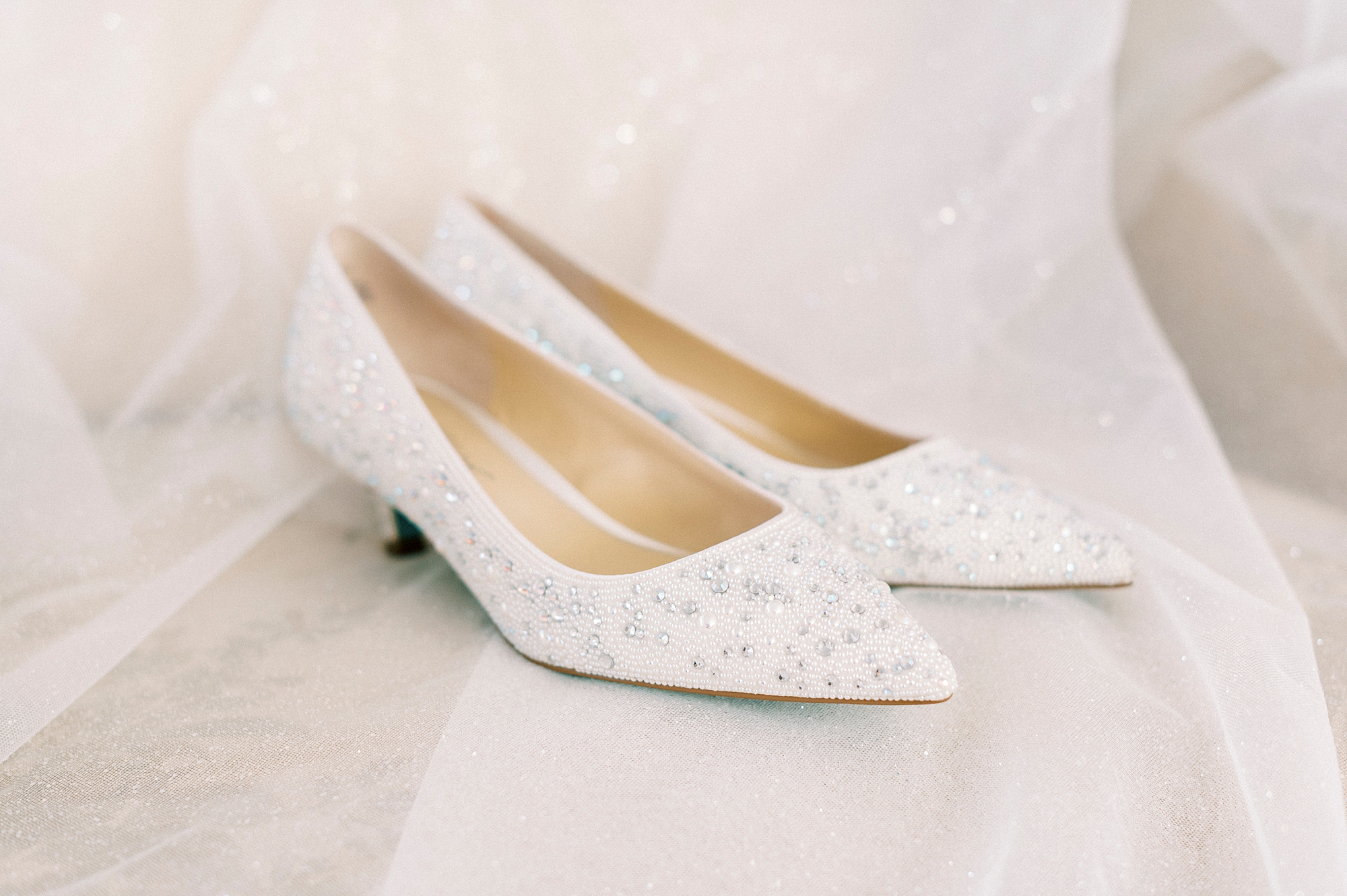 ivory shoes with silver accenting for winter wedding 