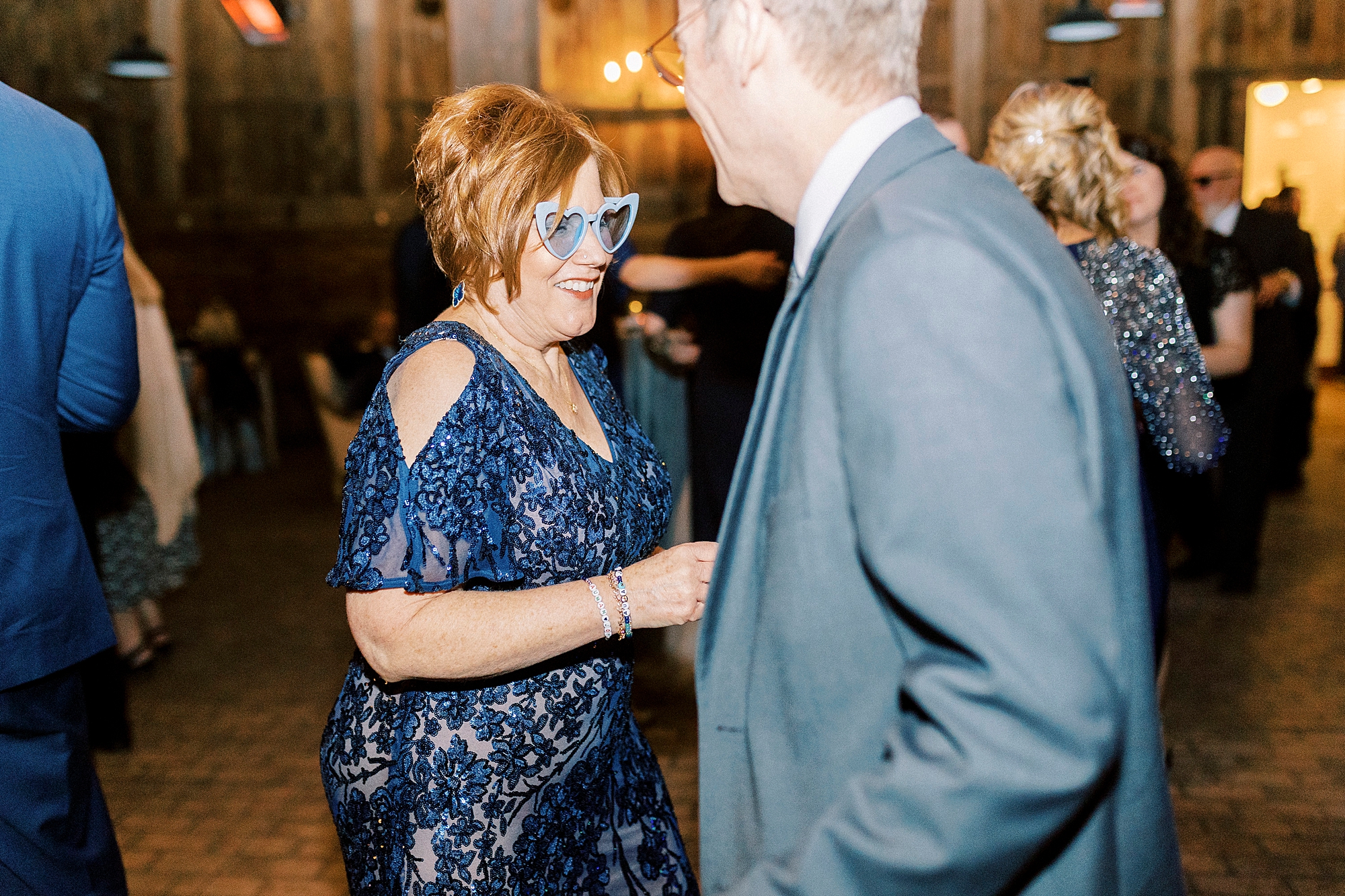 groom and mother dance together during NC wedding reception 
