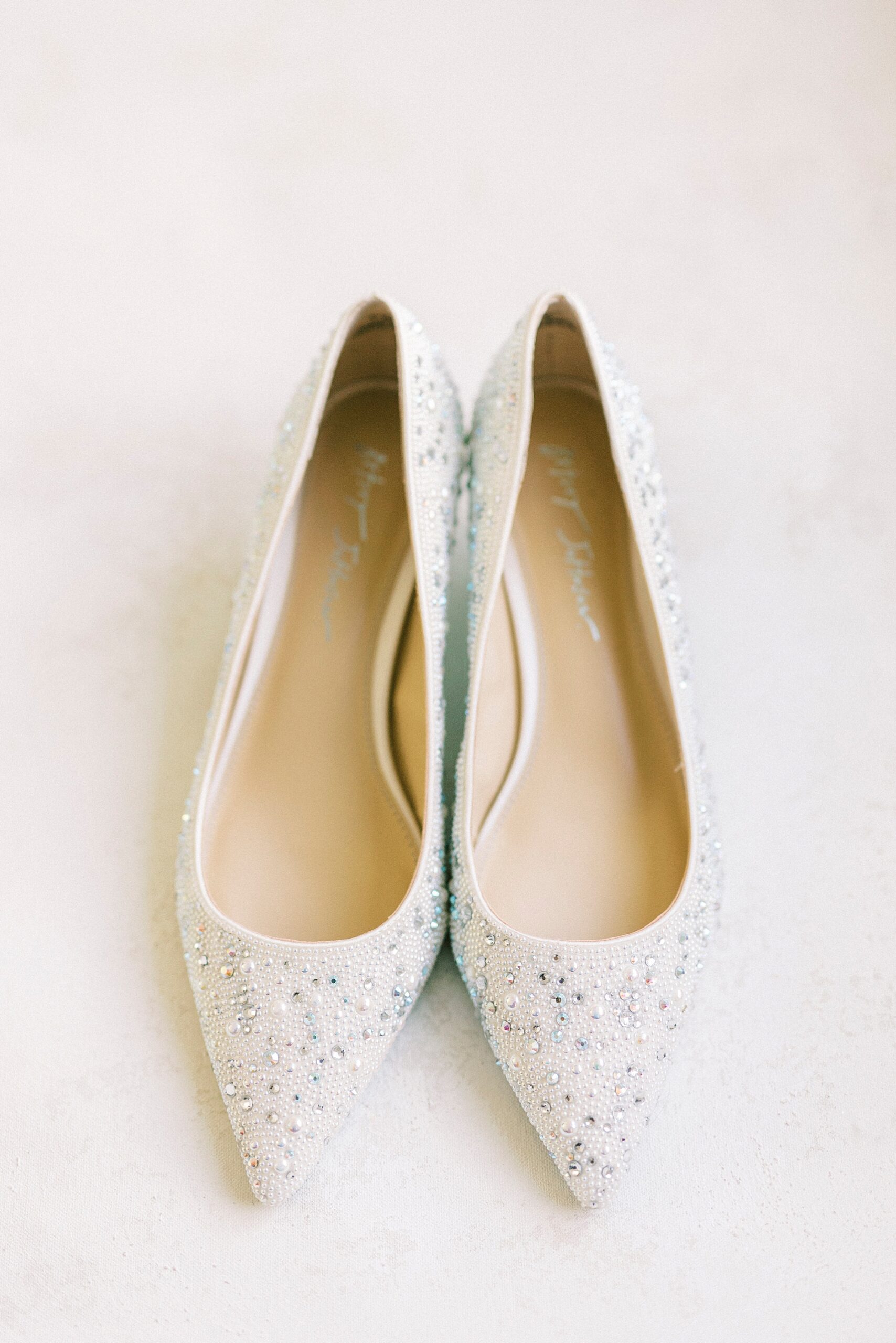 ivory shoes with silver accents for winter wedding 