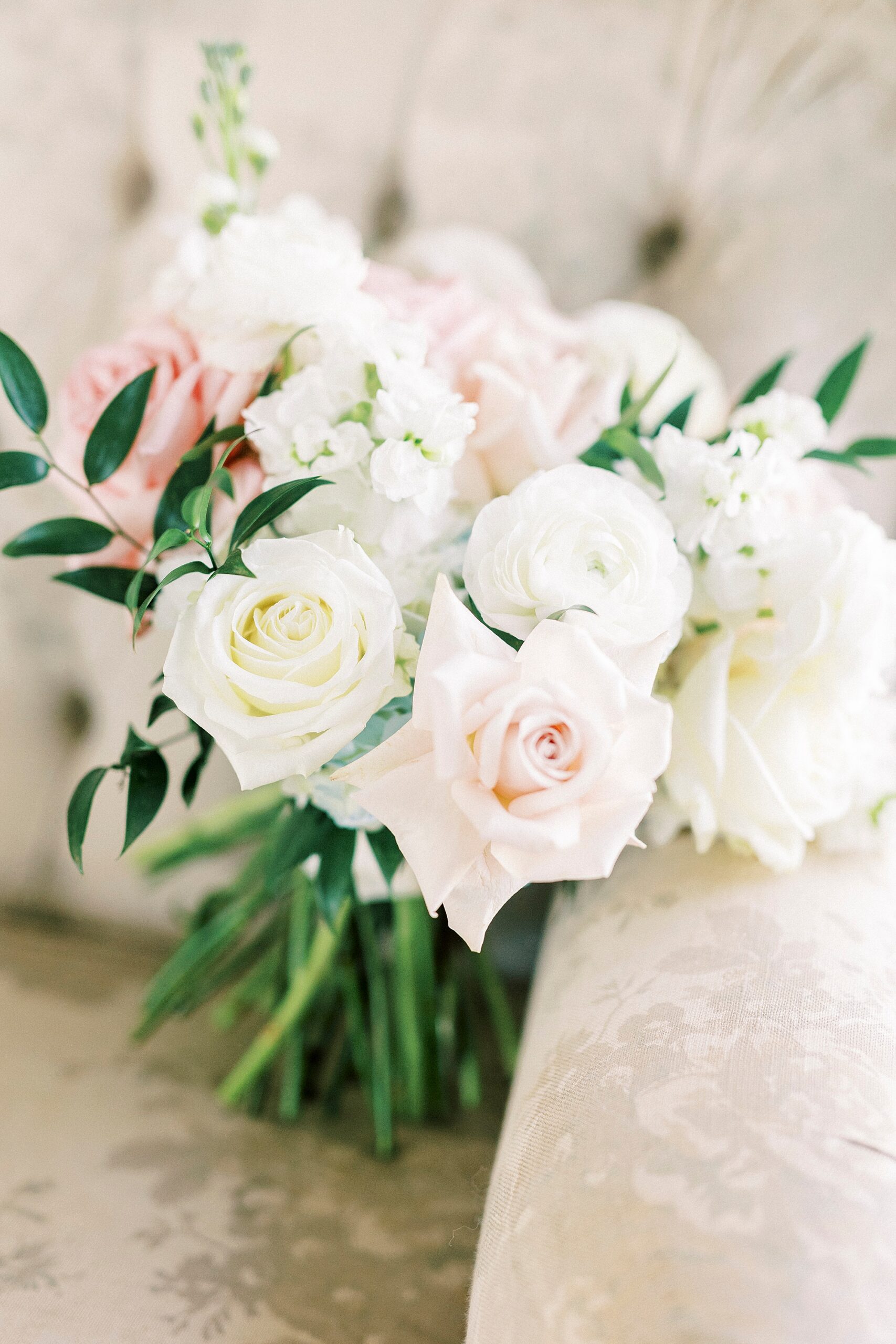 bride's bouquet of light pink and white roses for winter wedding
