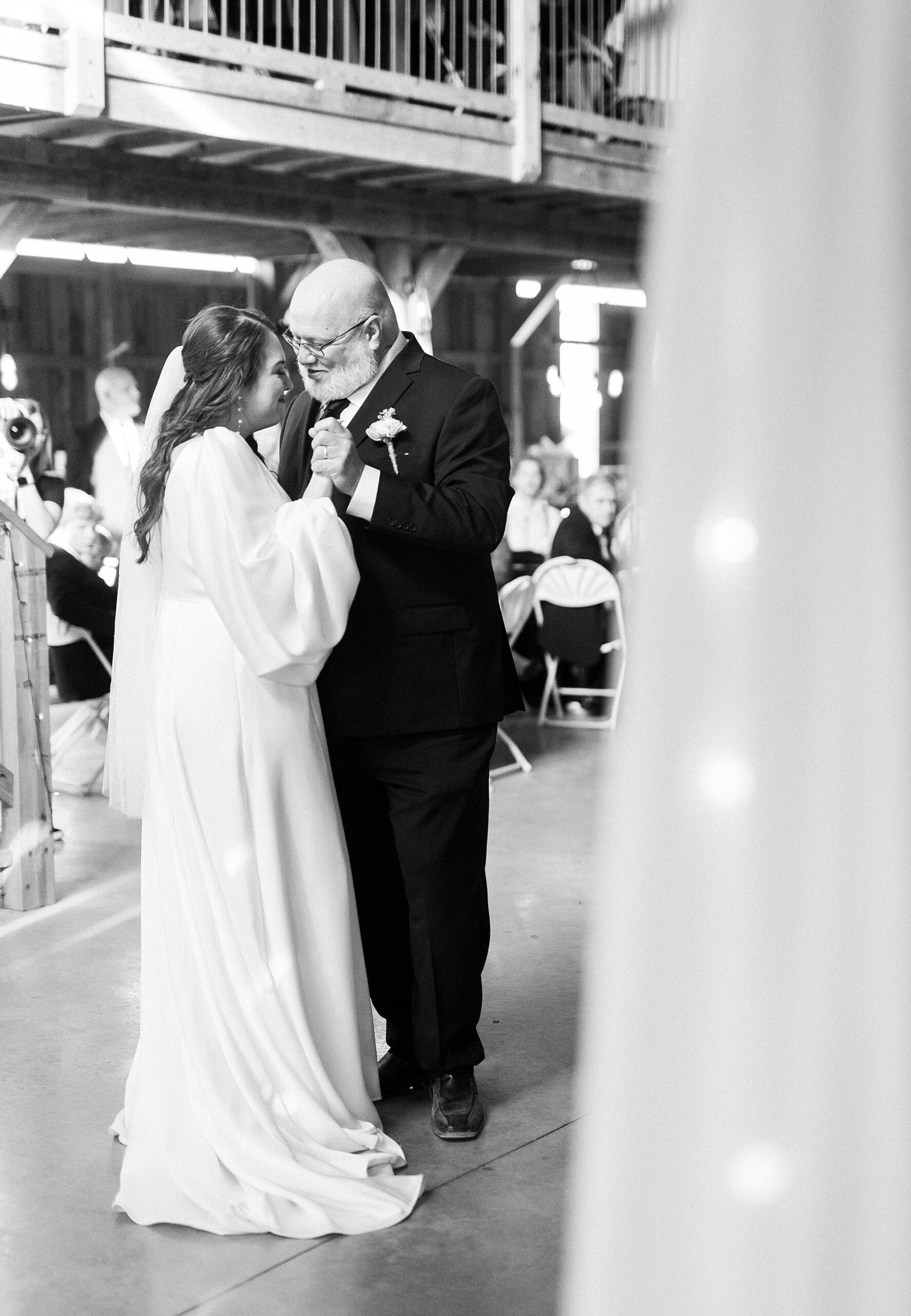 bride and dad dance together at during wedding reception in Mount Pleasant NC