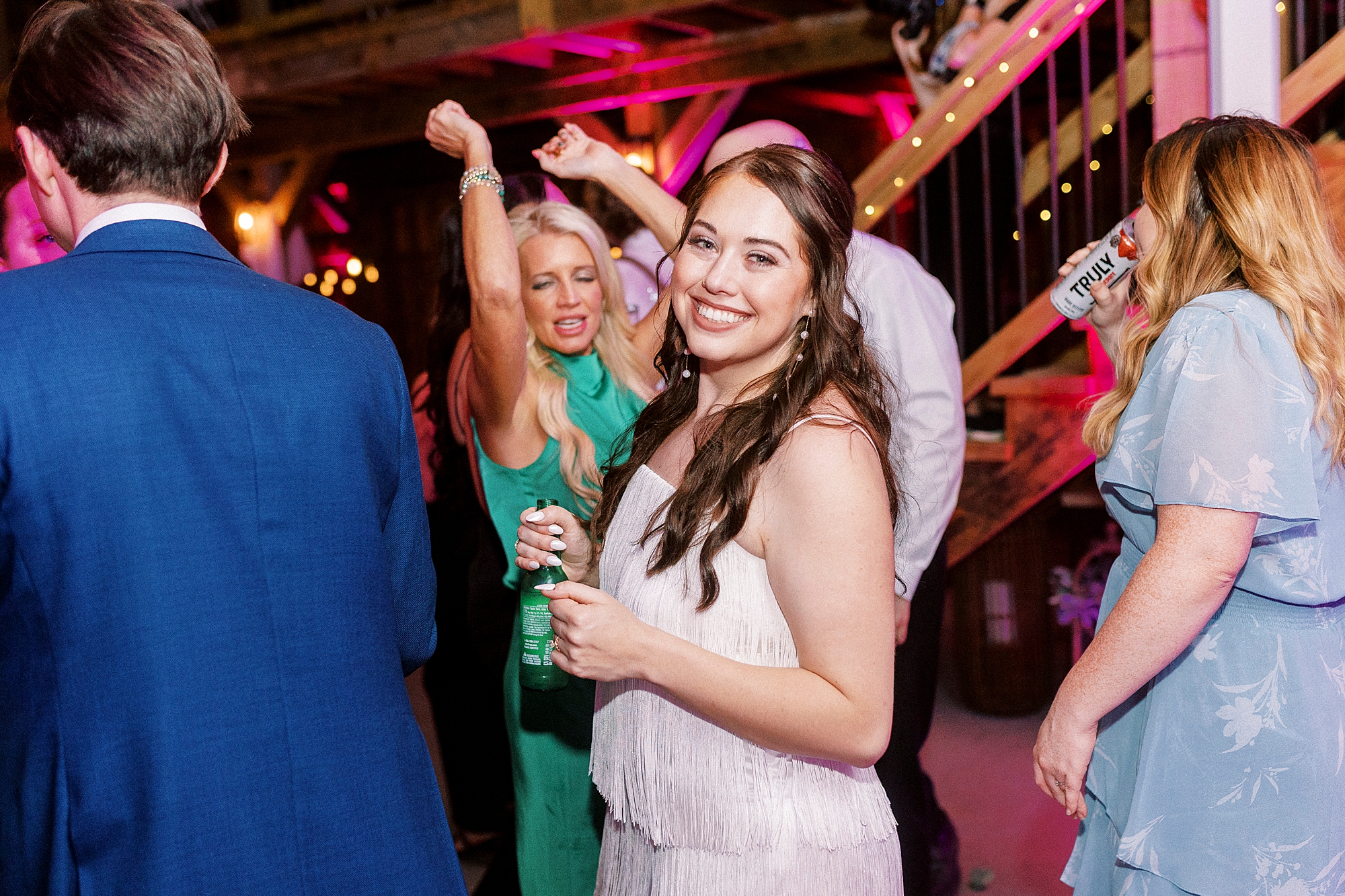 bride turns to smile on dance floor during during wedding reception in Mount Pleasant NC