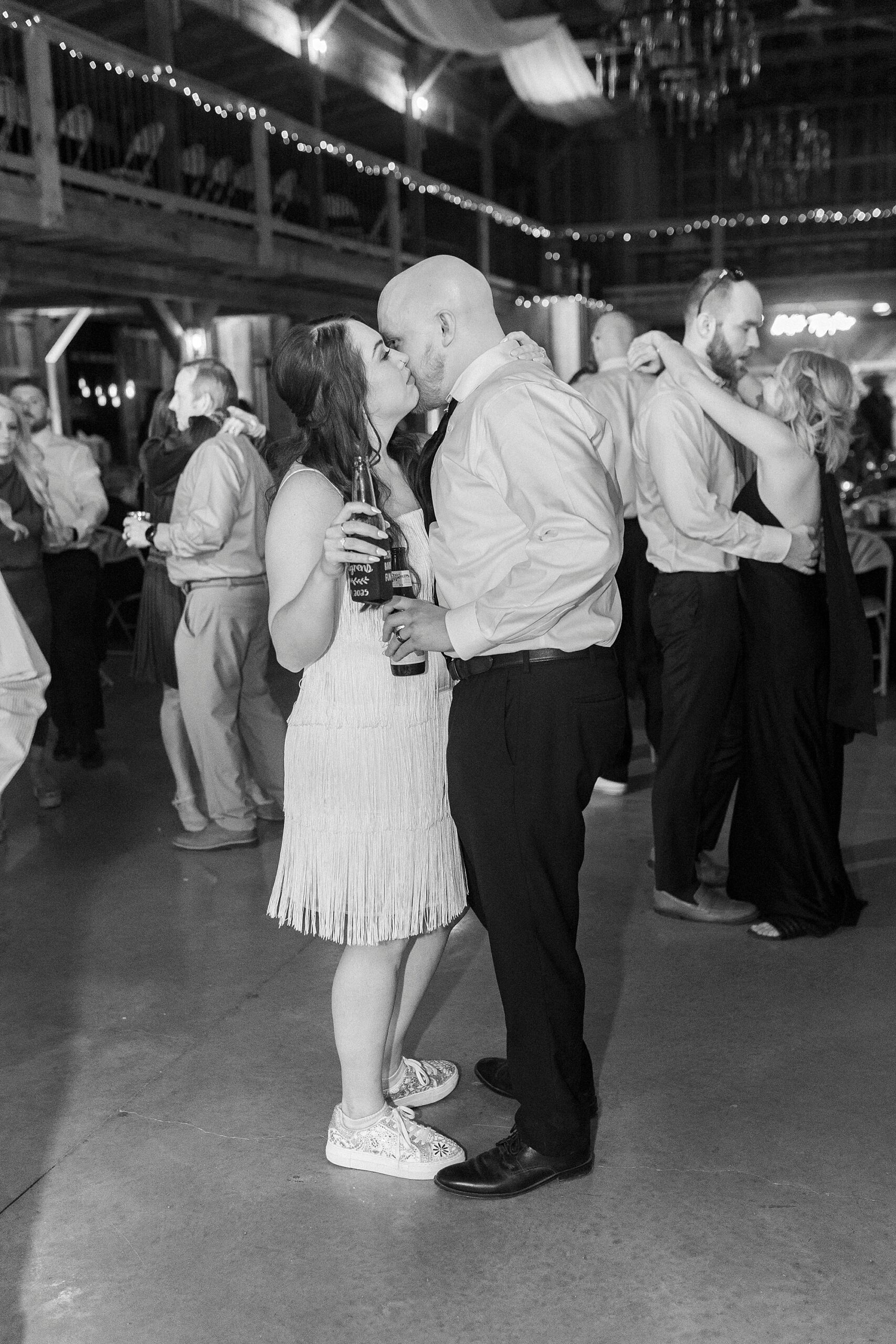 bride and groom kiss on dance floor during during wedding reception in Mount Pleasant NC