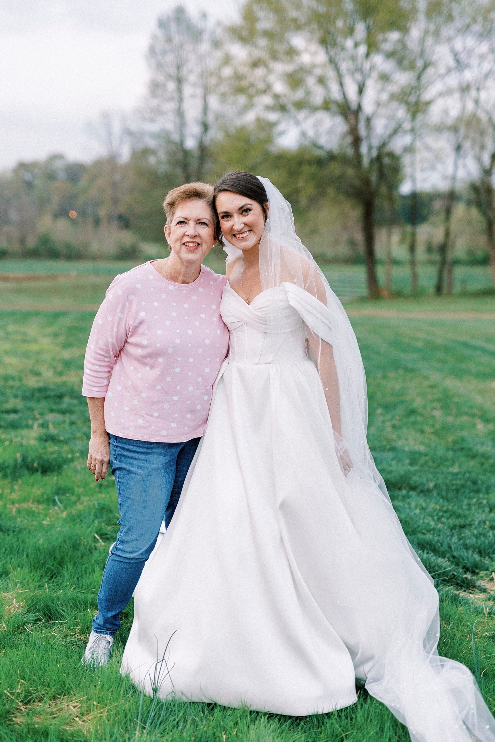 bride hugs mom during portraits at Low Meadows Estate