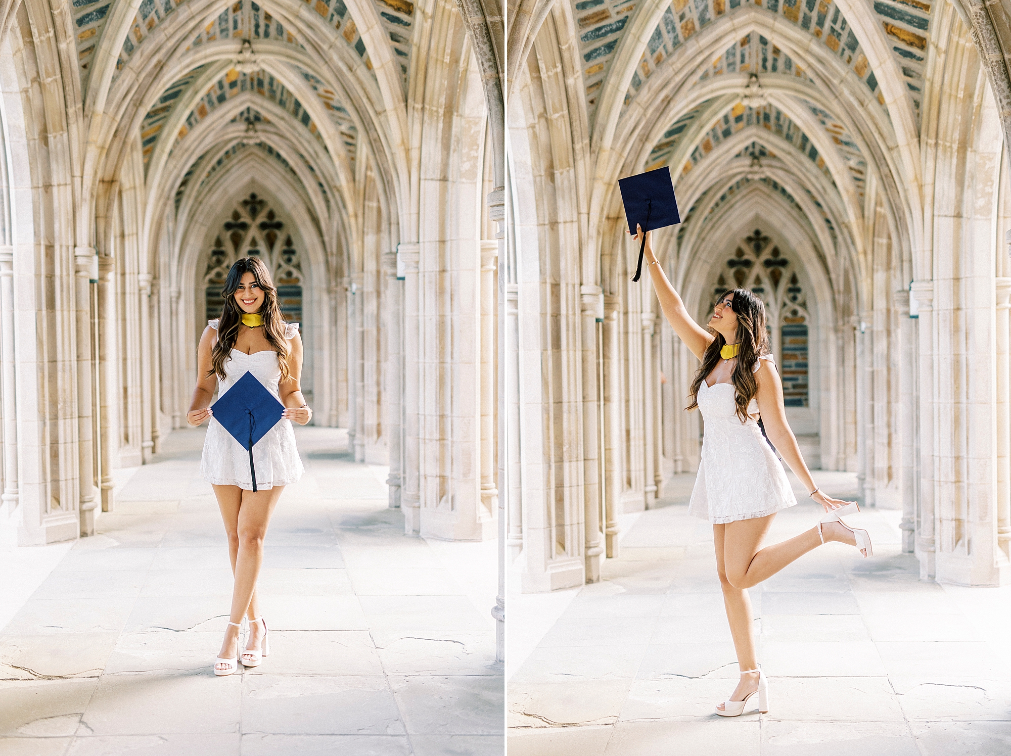 senior poses in white dress in arches of Duke Chapel with blue cap