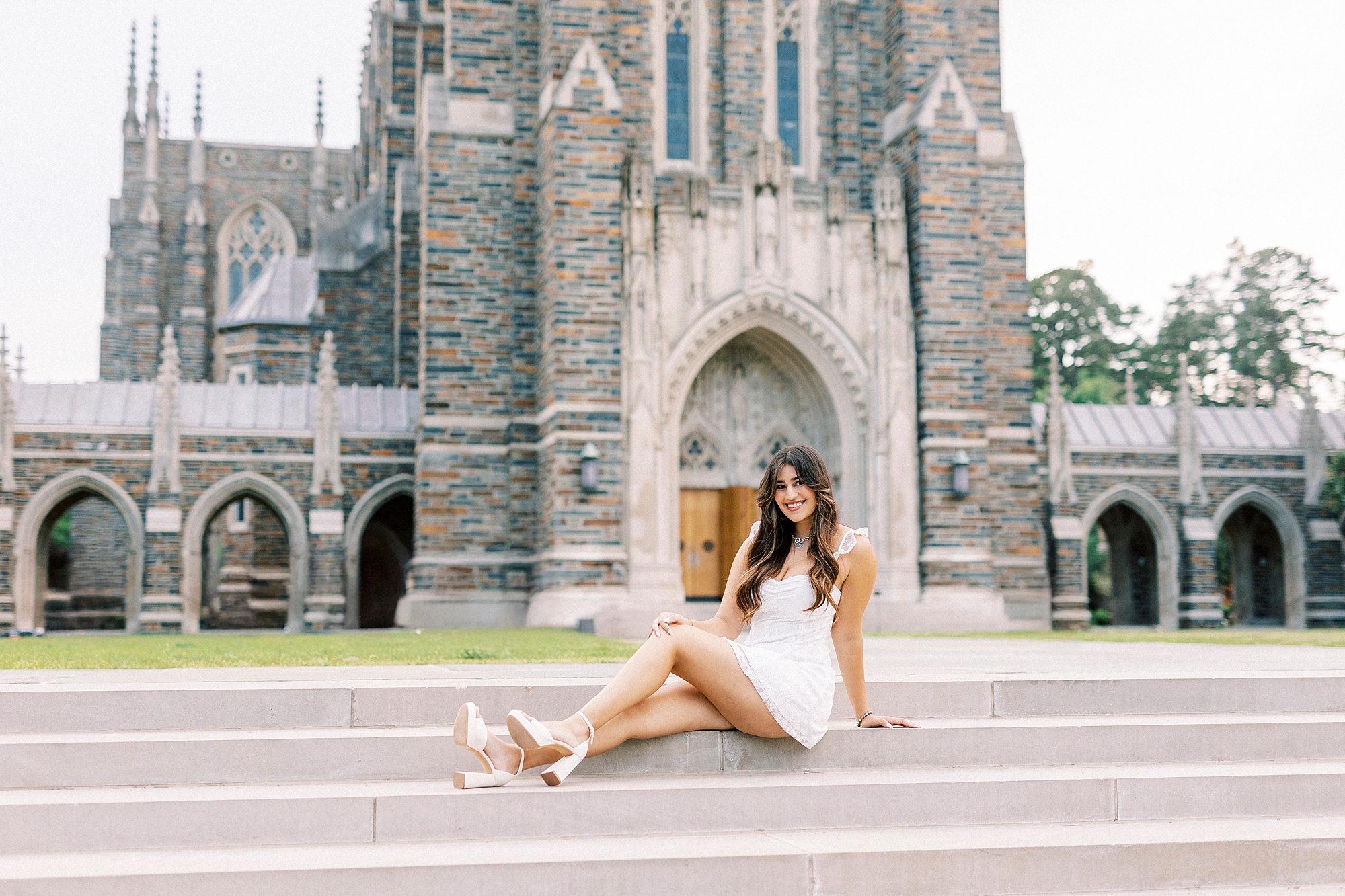 college senior sits on steps of Duke Chapel