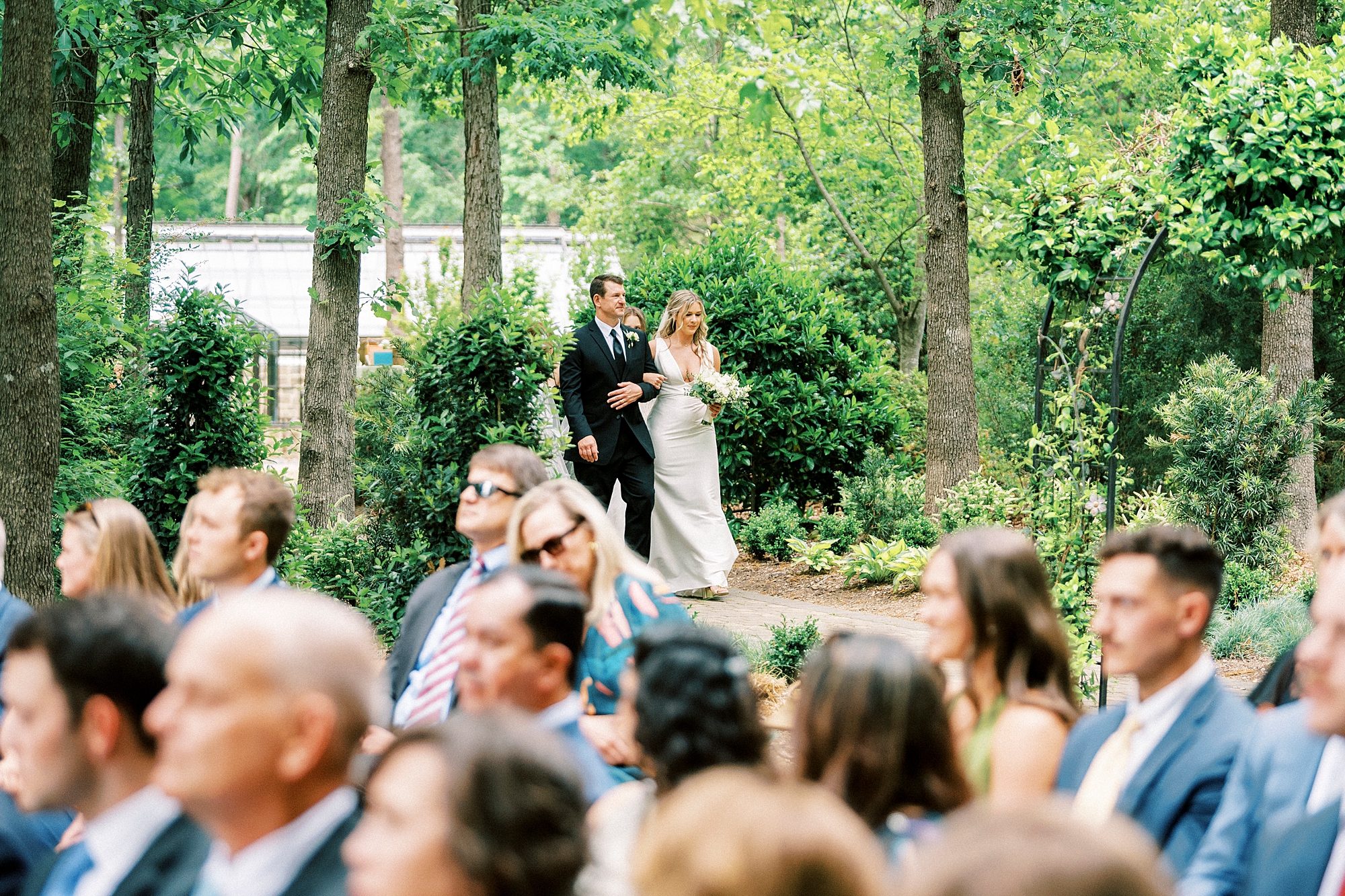 father escorts bride into wedding ceremony in garden of Morning Glory Farm