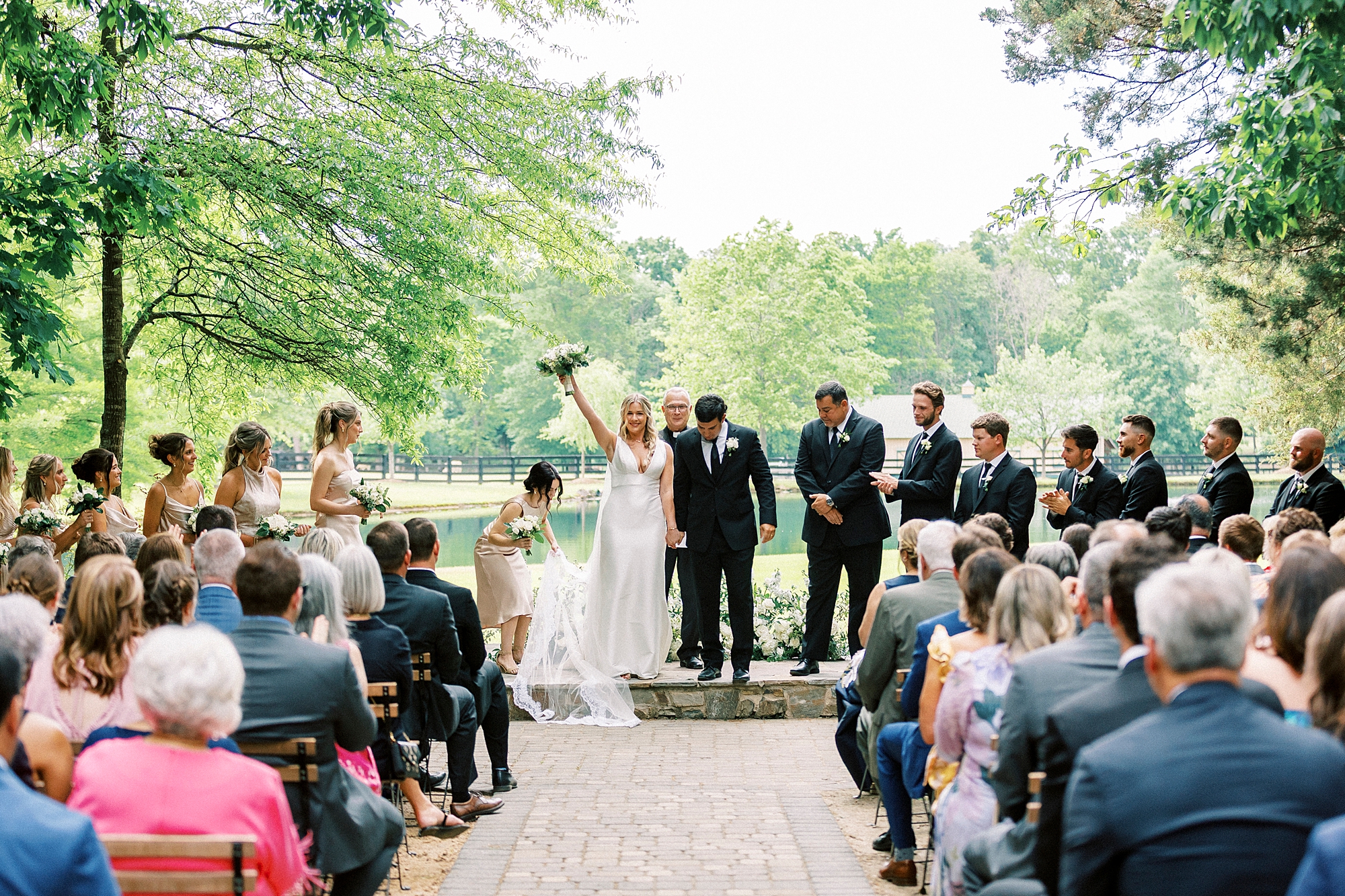 bride and groom cheer leaving wedding ceremony on lawn at Morning Glory Farm