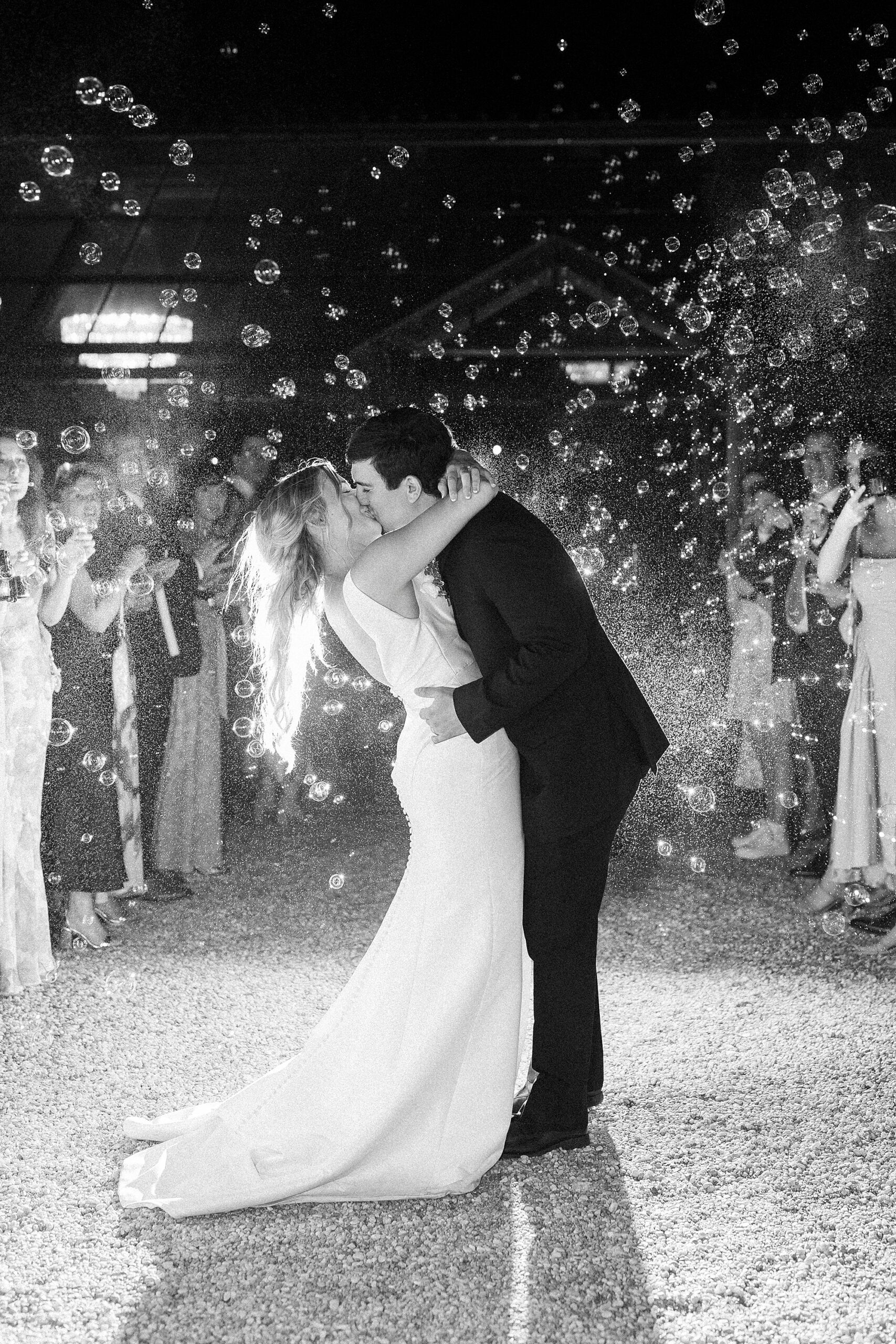 newlywed kiss at end of bubble exit at Morning Glory Farm
