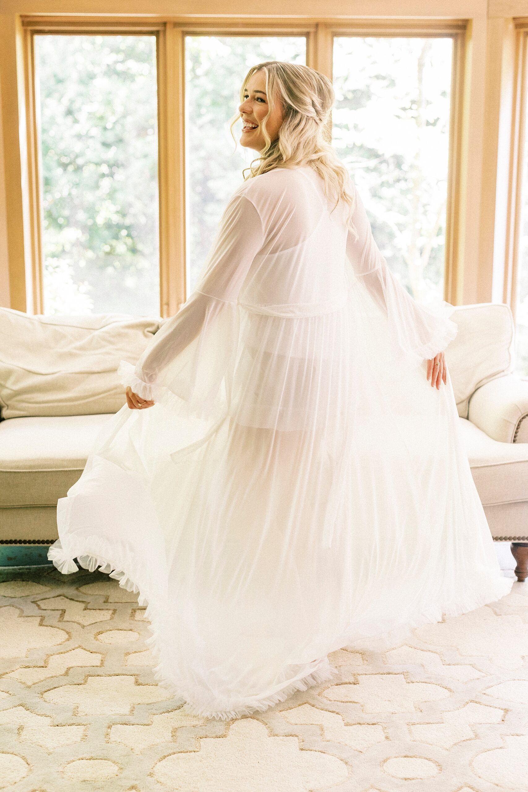 bride twirls in wedding dress showing off veil