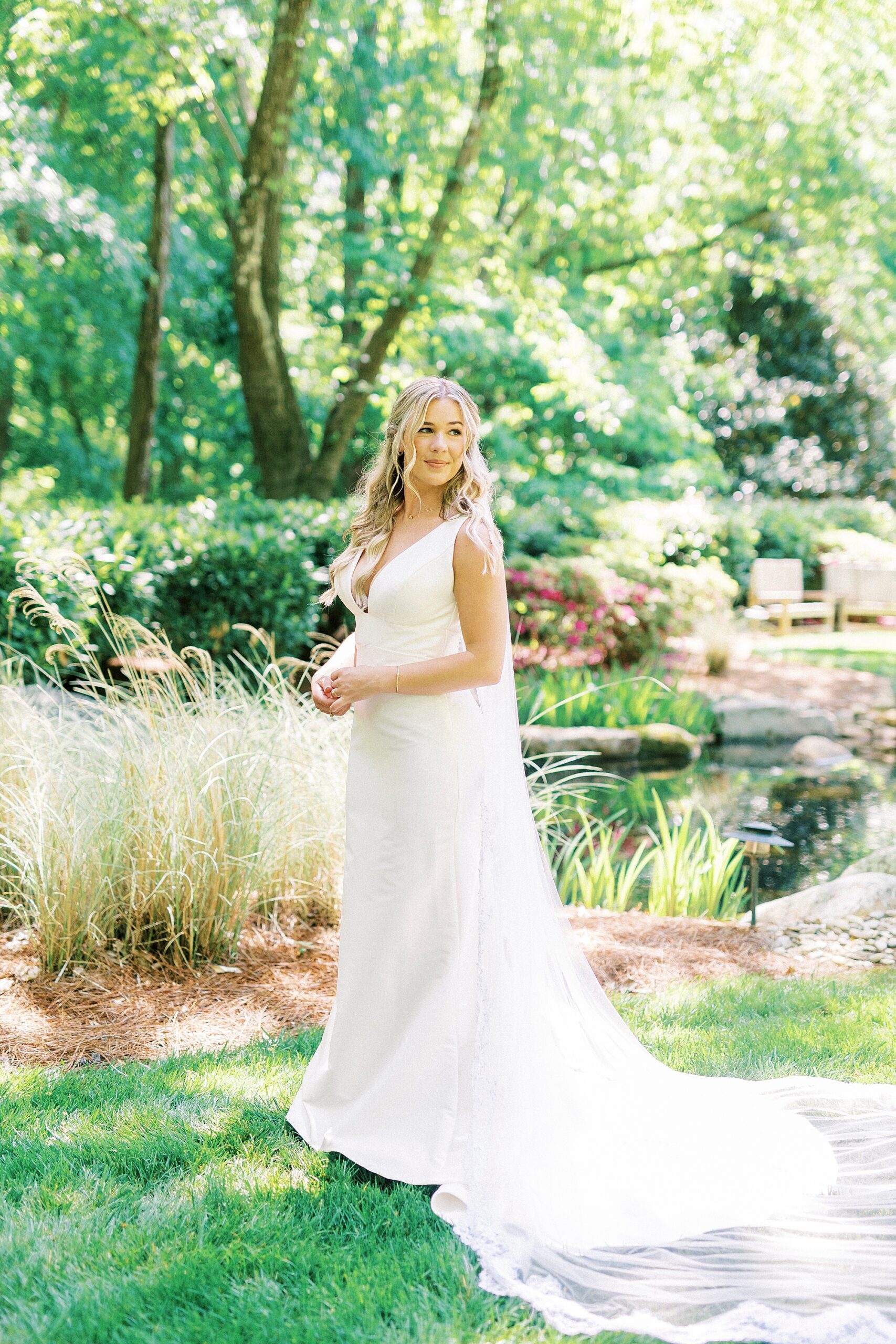 bride stands in gardens at Morning Glory Farm