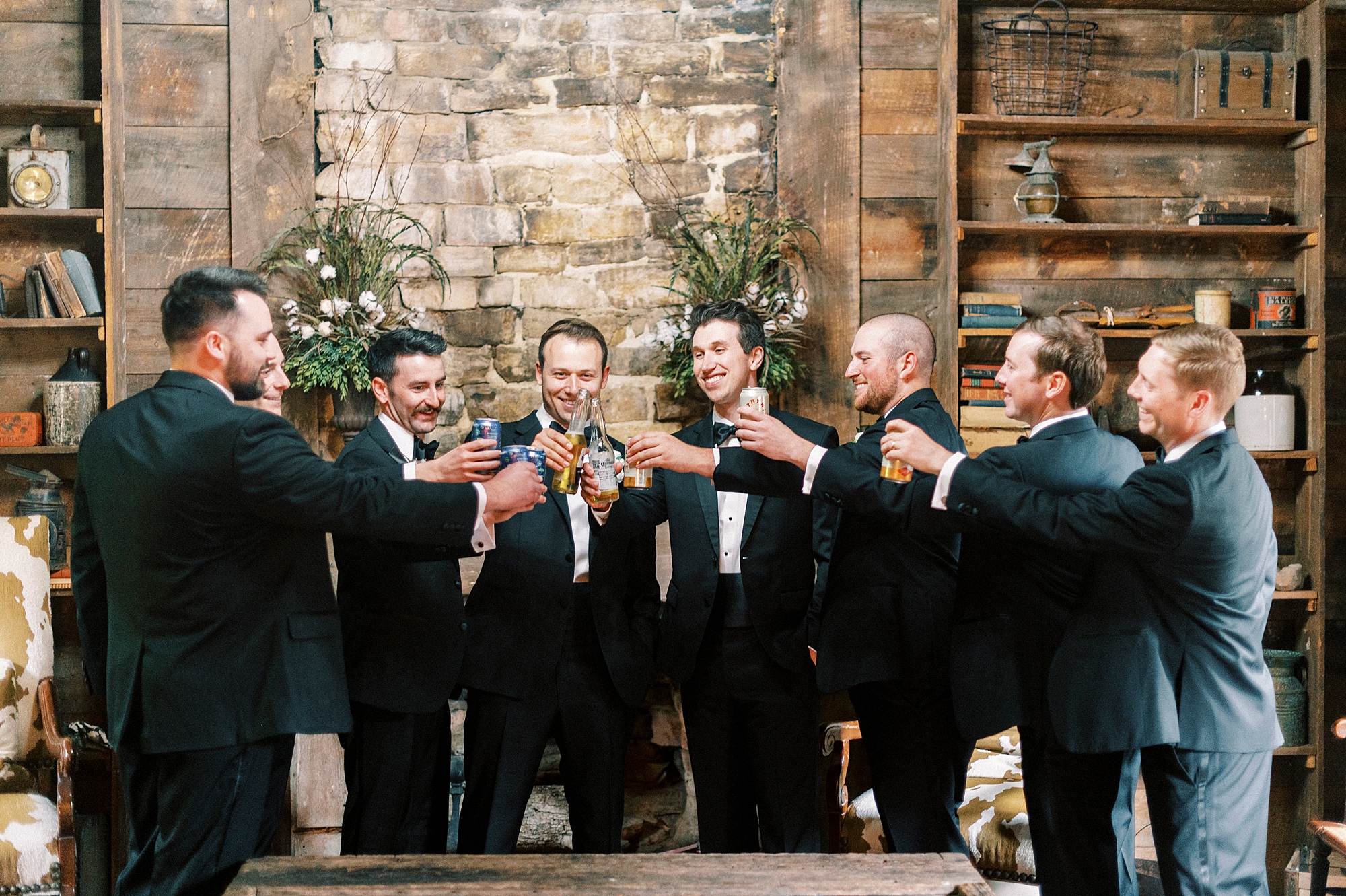 groomsmen toast drinks before wedding day in Wake Forest NC