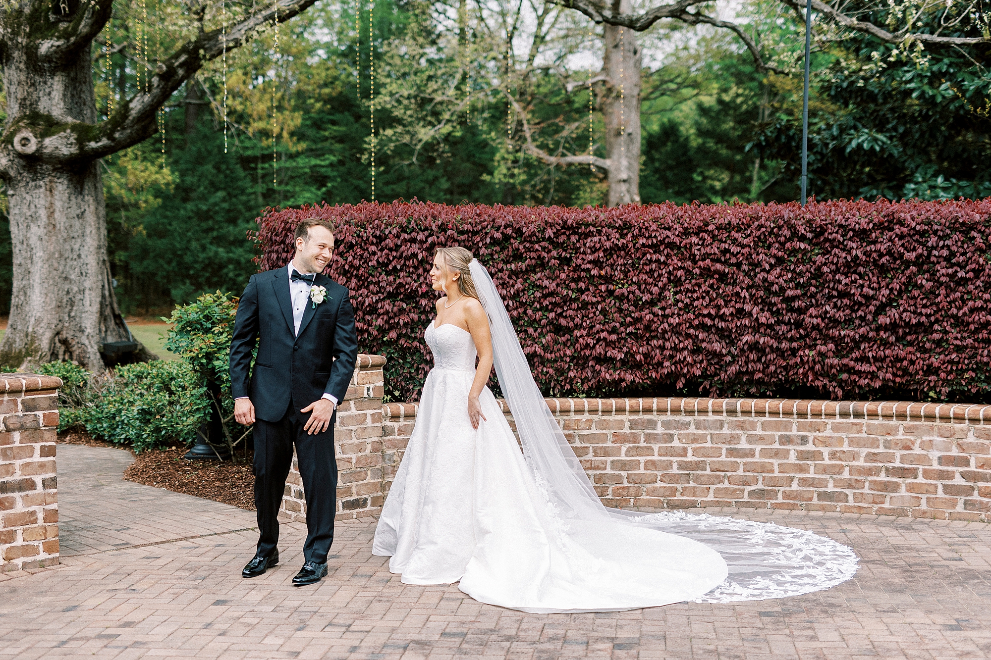 groom turns to look at bride outside the Sutherland