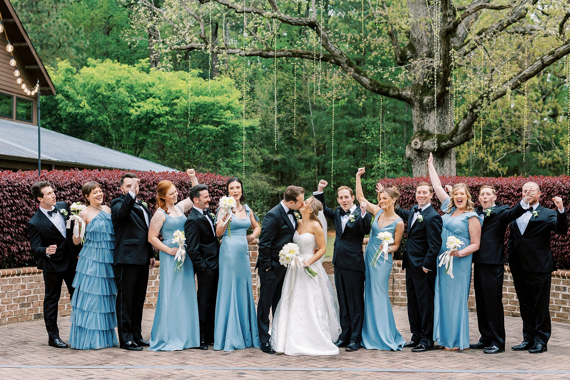 newlyweds stand in line with bridesmaids and groomsmen at the Sutherland